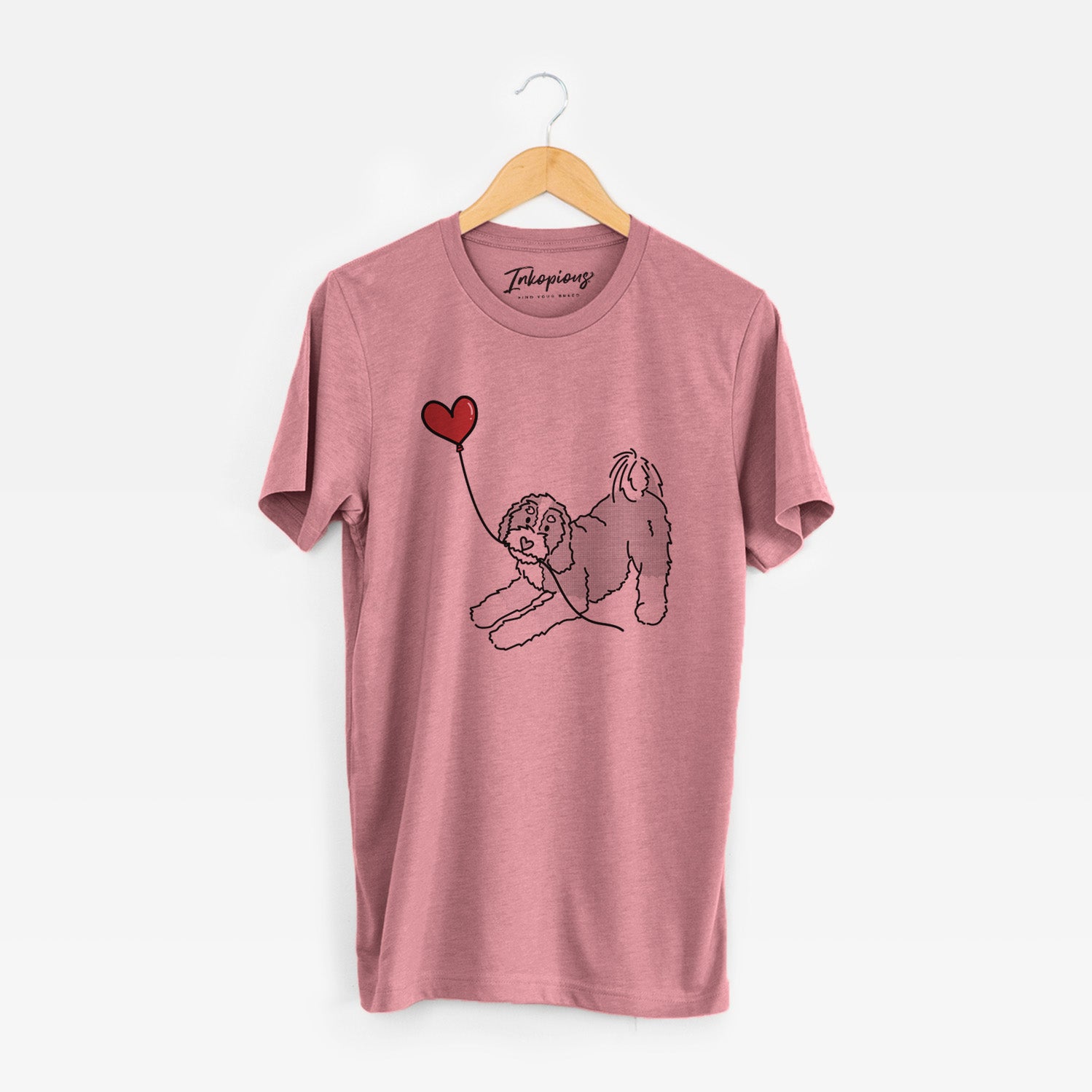 Minimalist line drawing of a Bernedoodle Heart String holding a heart balloon on a Mauve Unisex crewneck