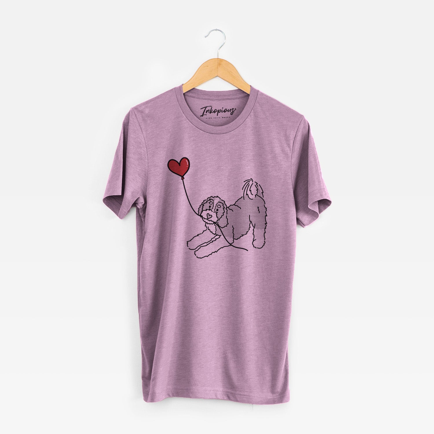 Minimalist line drawing of a Bernedoodle Heart String holding a heart balloon on an Orchid Unisex crewneck