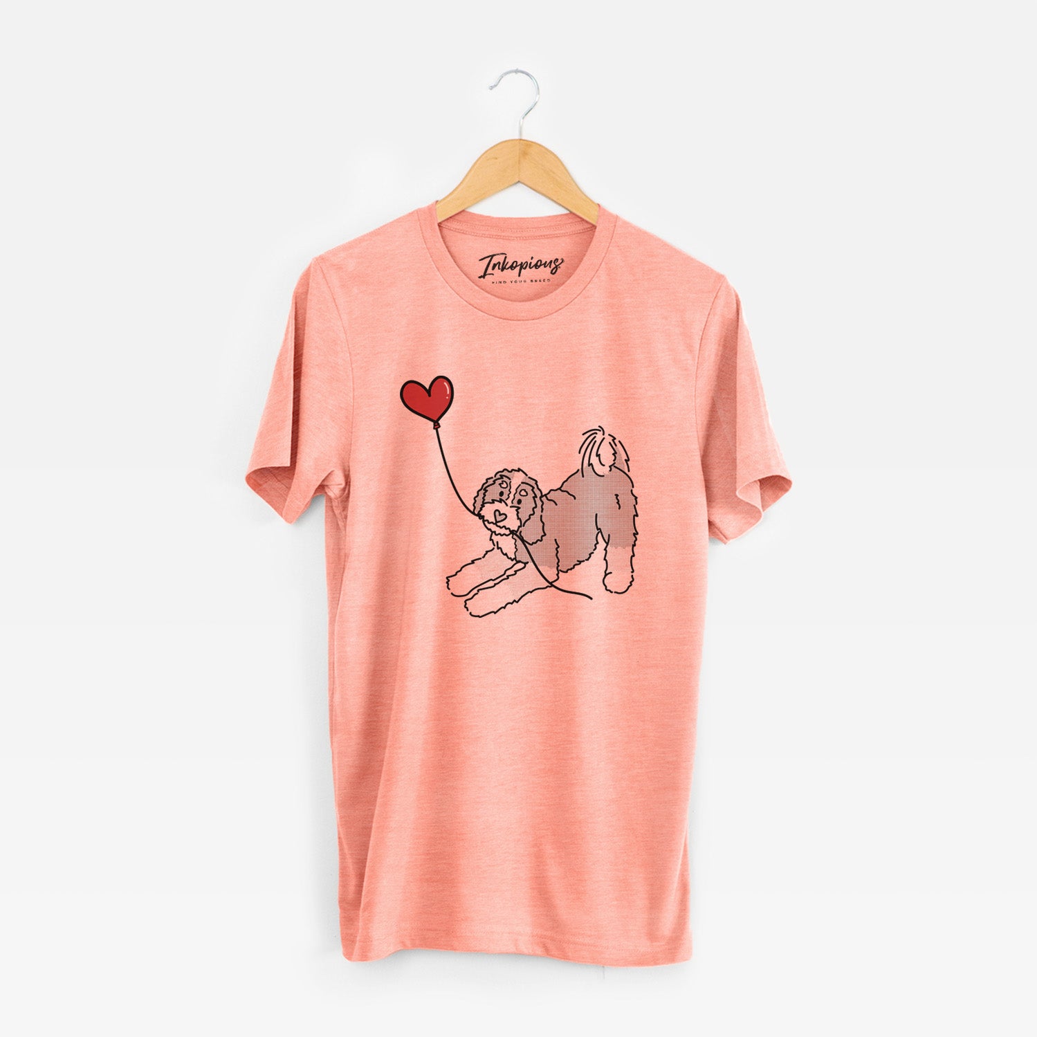 Minimalist line drawing of a Bernedoodle Heart String holding a heart balloon on a Sunset Unisex crewneck