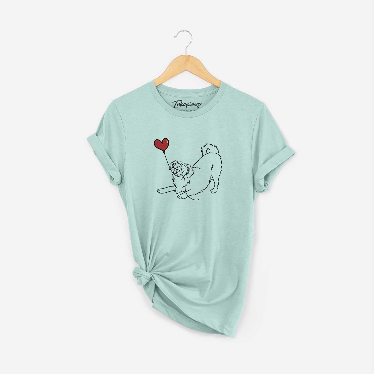 Minimalist line drawing of a Bernese Mountain Dog Heart String holding a heart balloon on a Heather Sage Unisex crewneck