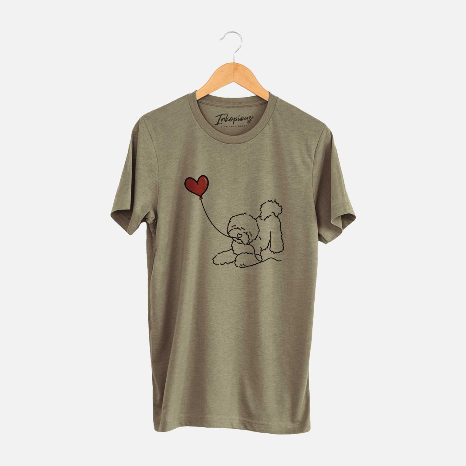Minimalist line drawing of a Bichon Frise Heart String holding a heart balloon on an Olive Unisex crewneck