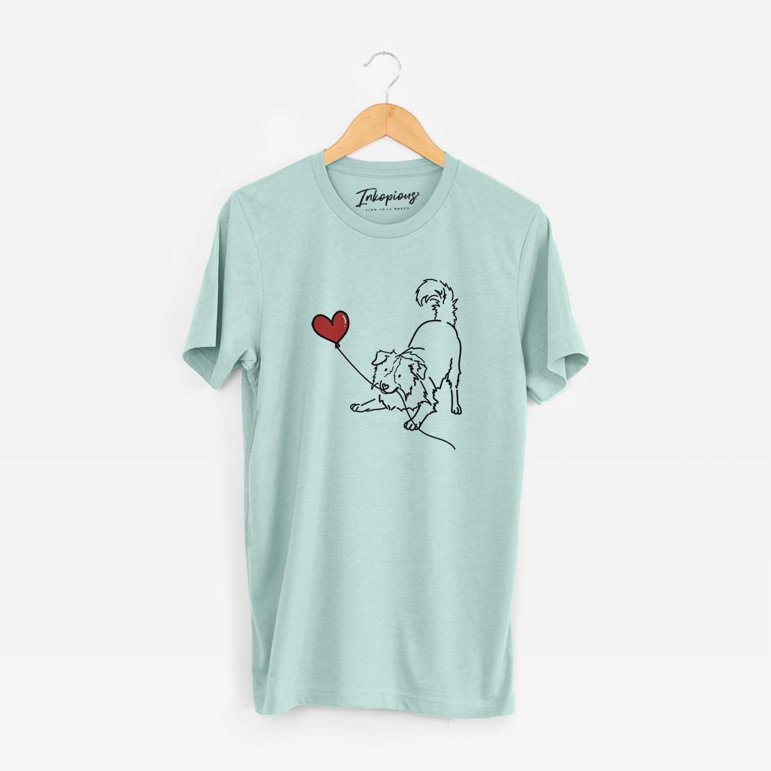 Minimalist line drawing of a Border Collie Heart String holding a heart balloon on a Heather Sage Unisex crewneck
