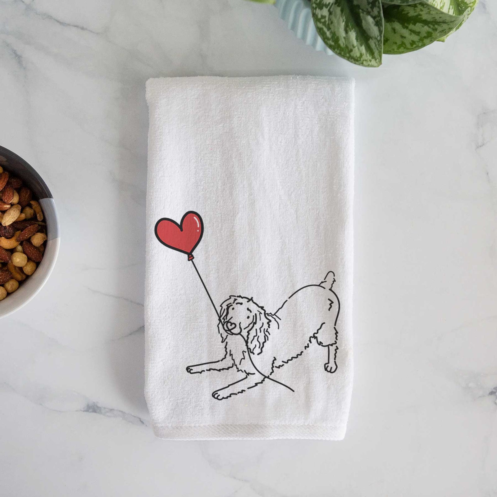 Minimalist line drawing of a Boykin Spaniel Heart String holding a heart balloon on a decorative hand towel
