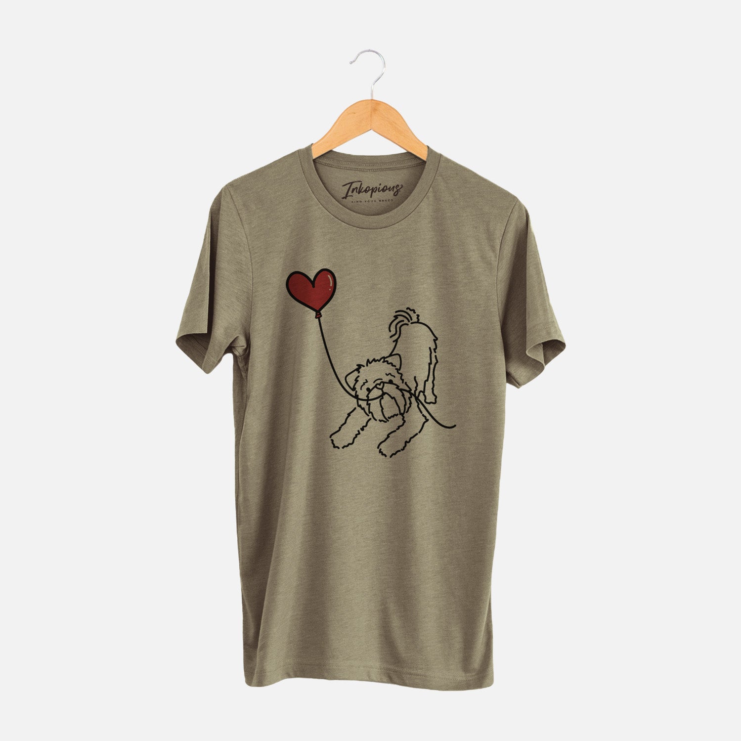 Minimalist line drawing of a Brussels Griffon Heart String holding a heart balloon on an Olive Unisex crewneck
