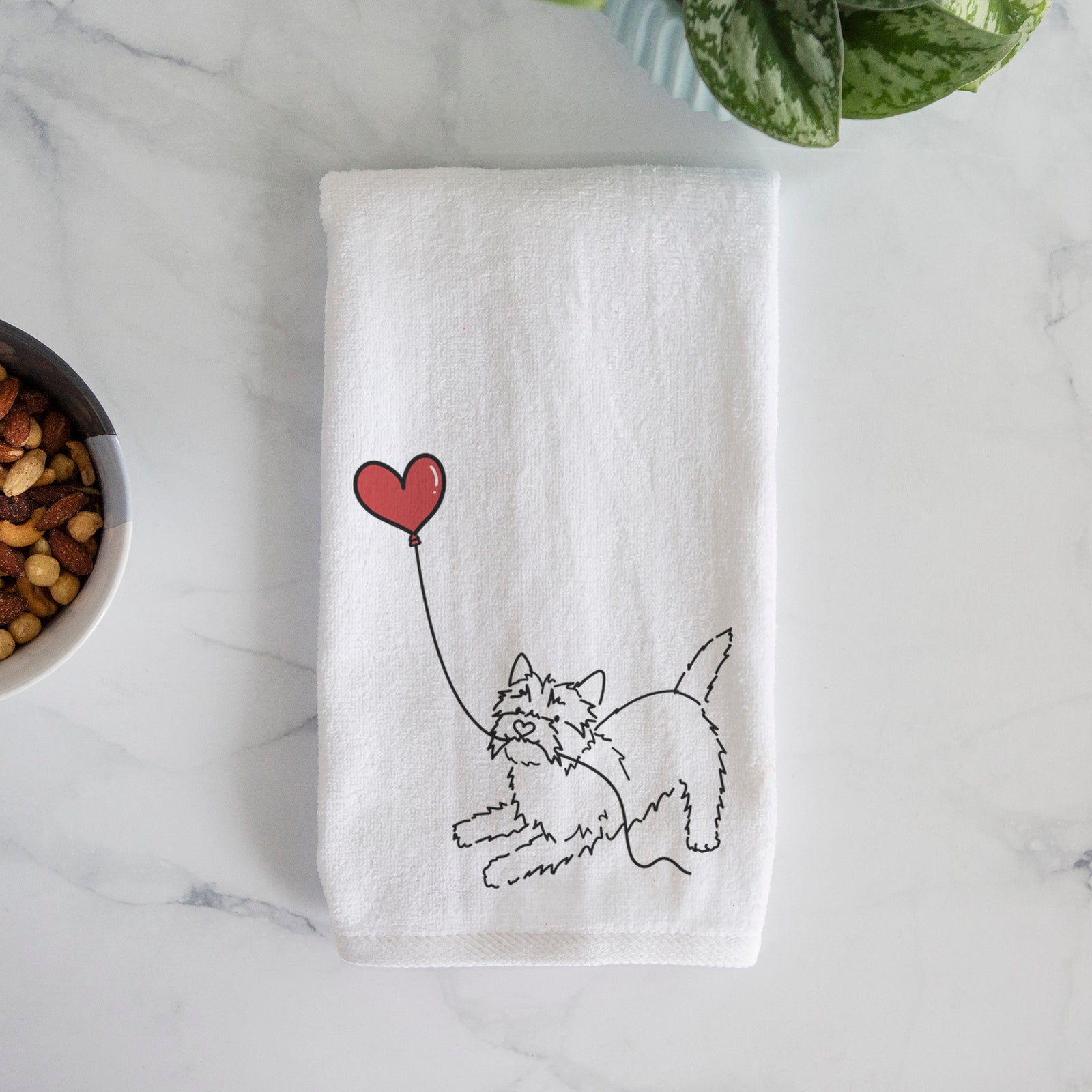 Minimalist line drawing of a Cairn Terrier Heart String holding a heart balloon on a decorative hand towel