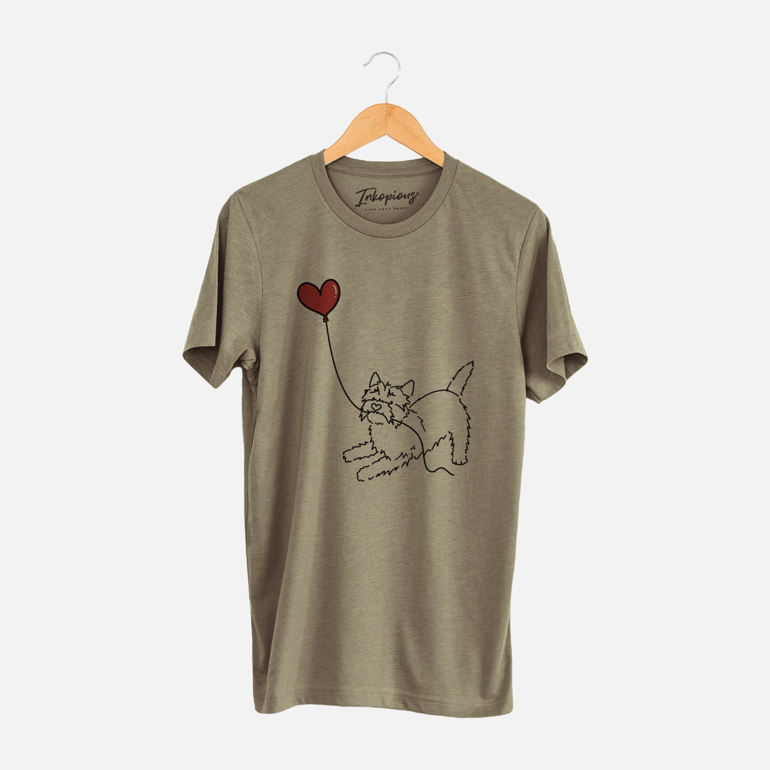 Minimalist line drawing of a Cairn Terrier Heart String holding a heart balloon on an Olive Unisex crewneck