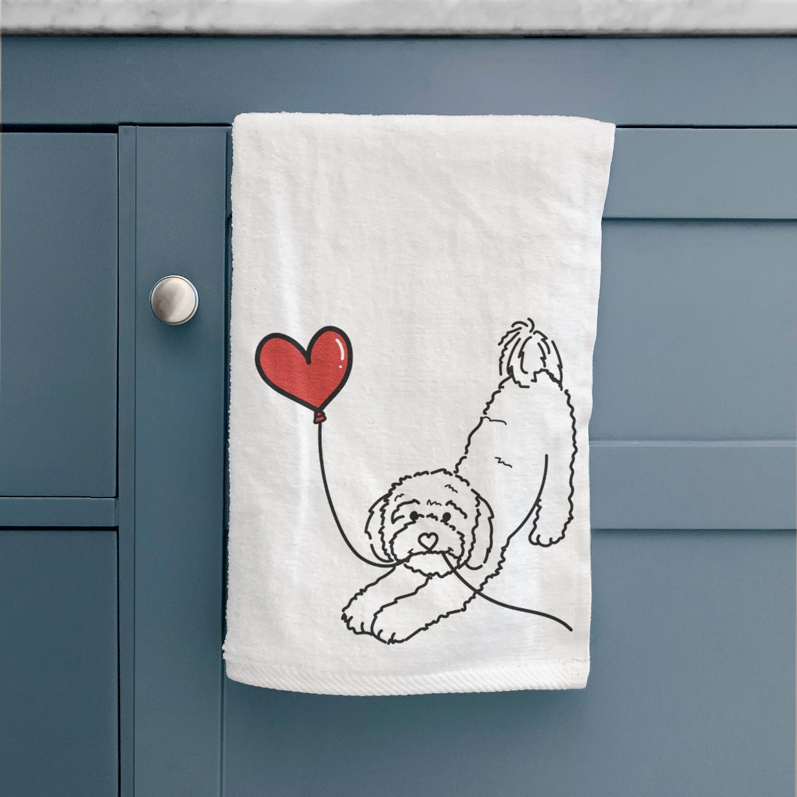 Minimalist line drawing of a Cavapoo Heart String holding a heart balloon on a decorative hand towel