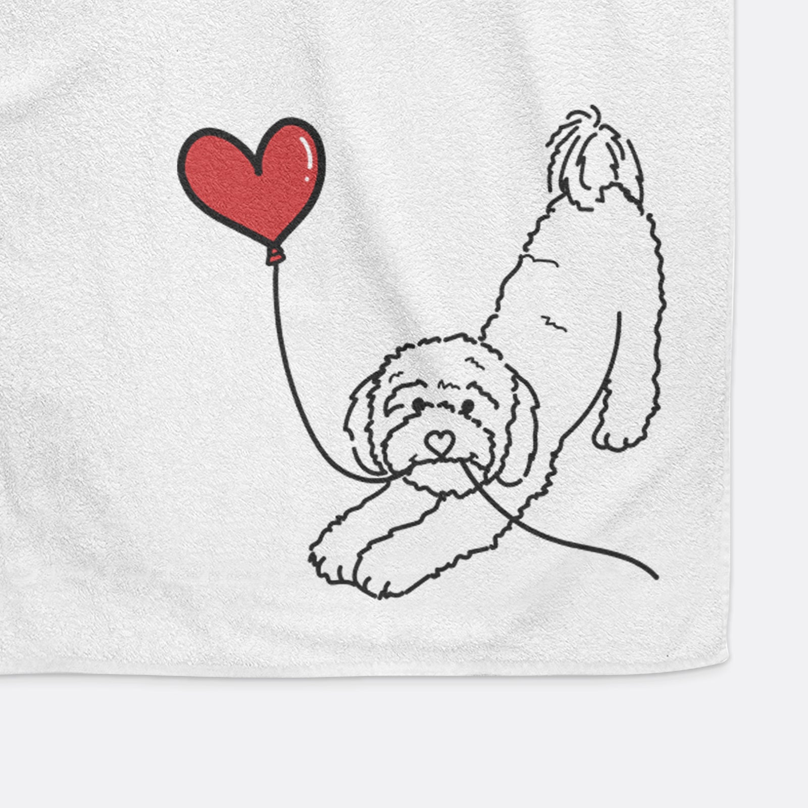 Minimalist line drawing of a Cavapoo Heart String holding a heart balloon on a decorative hand towel