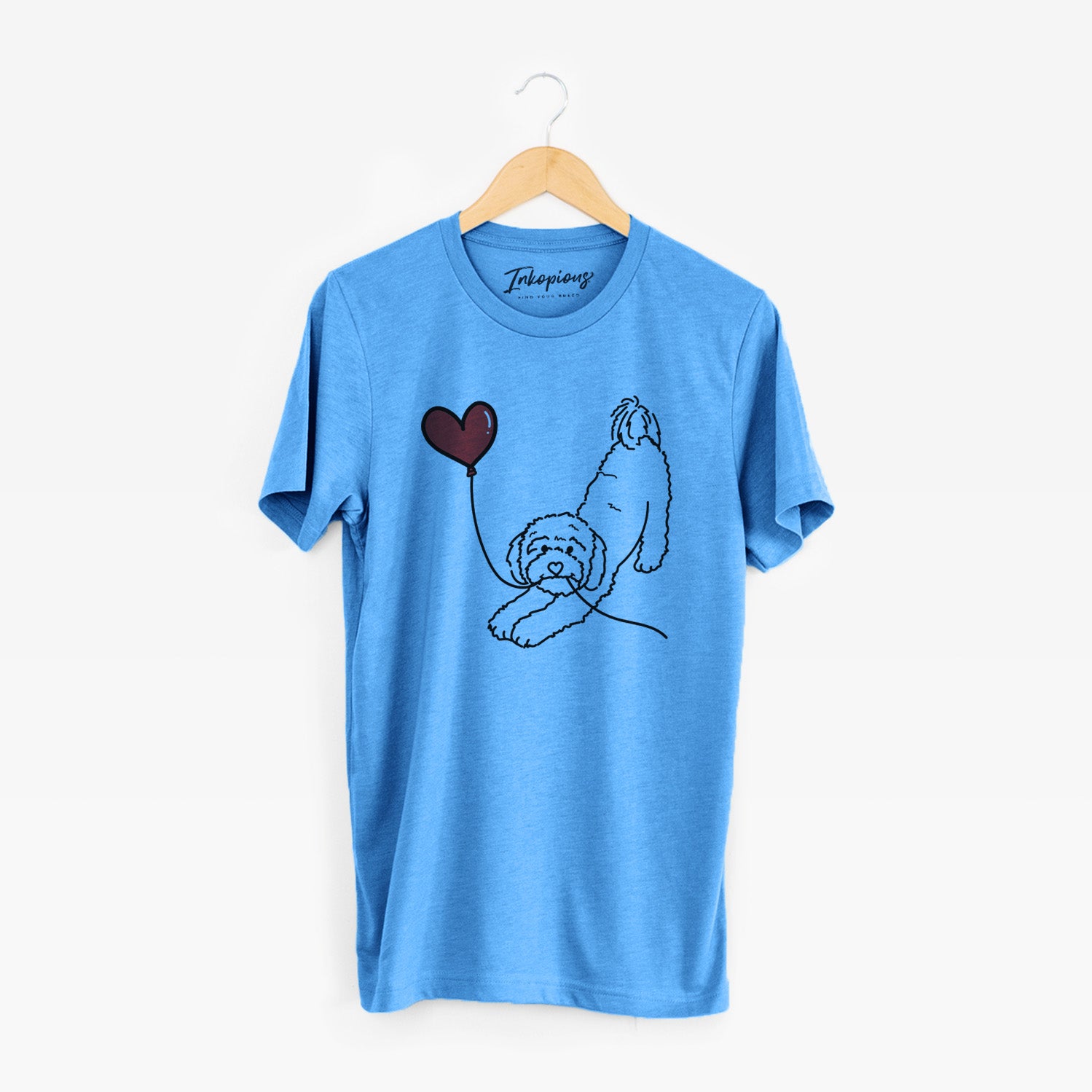 Minimalist line drawing of a Cavapoo Heart String holding a heart balloon on a Blue Unisex crewneck