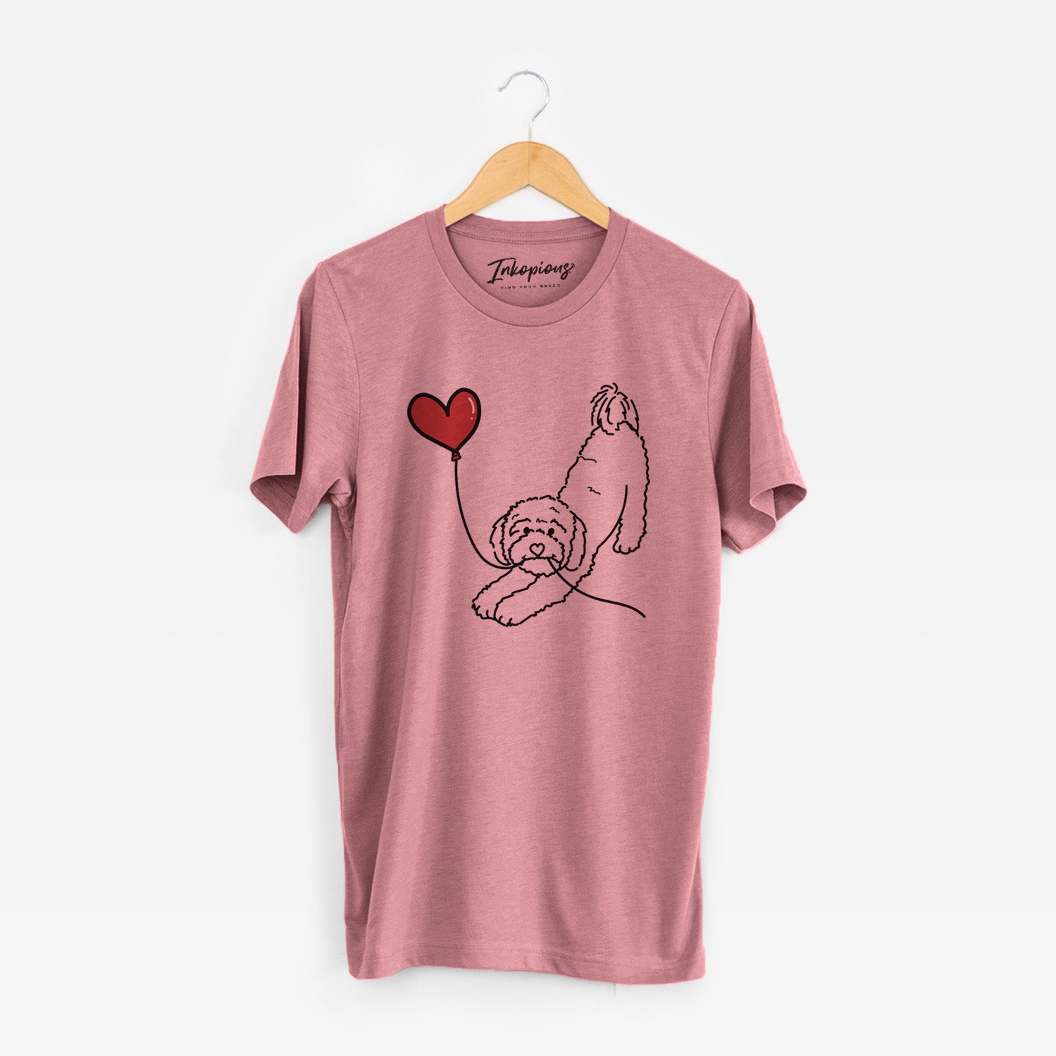 Minimalist line drawing of a Cavapoo Heart String holding a heart balloon on a Mauve Unisex crewneck