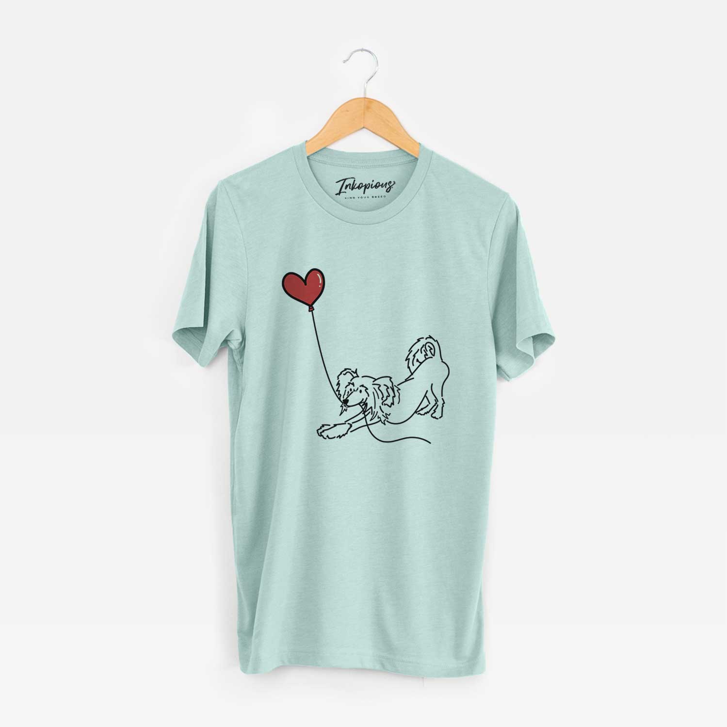 Minimalist line drawing of a Chinese Crested Heart String holding a heart balloon on a Heather Sage Unisex crewneck