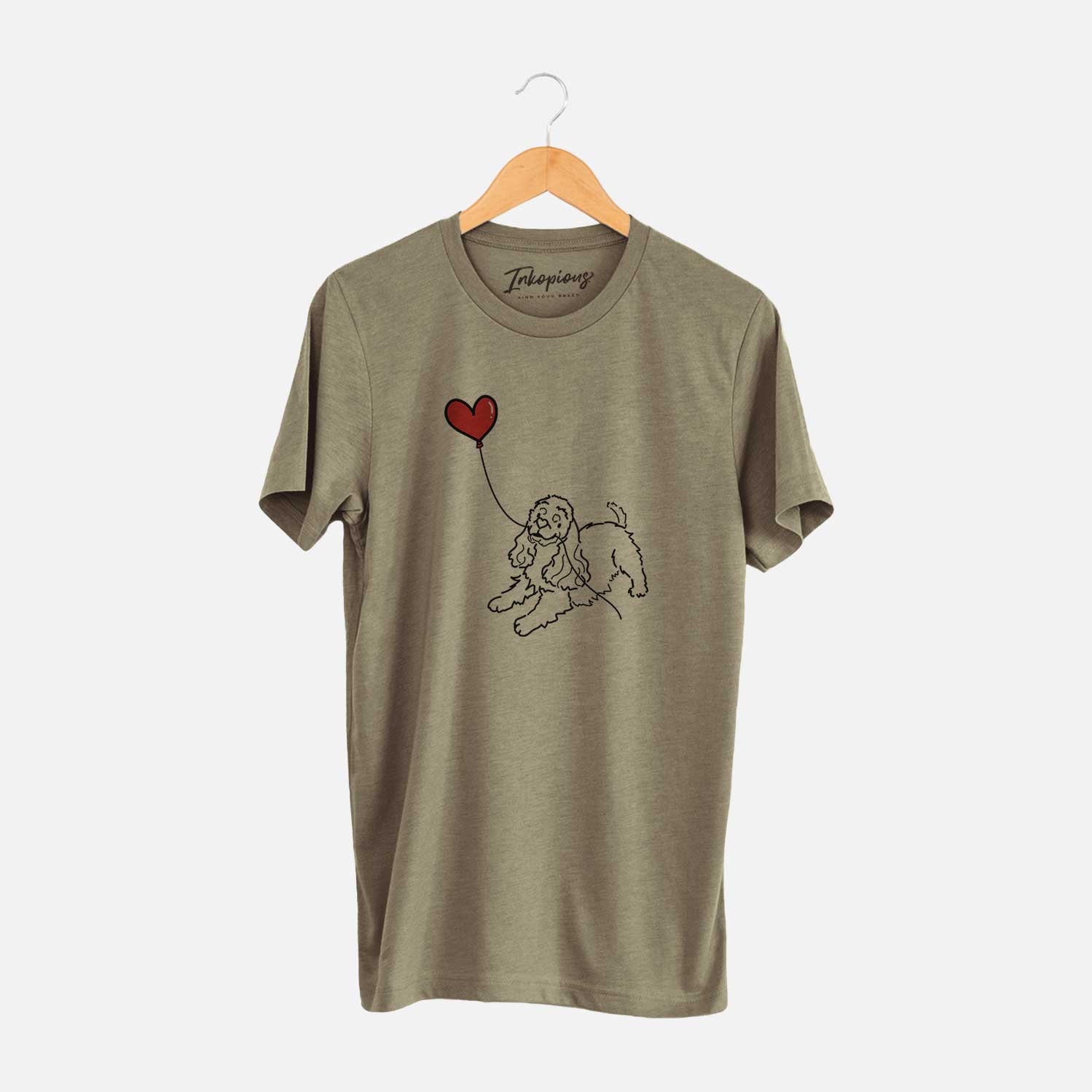 Minimalist line drawing of a Cocker Spaniel Heart String holding a heart balloon on an Olive Unisex crewneck