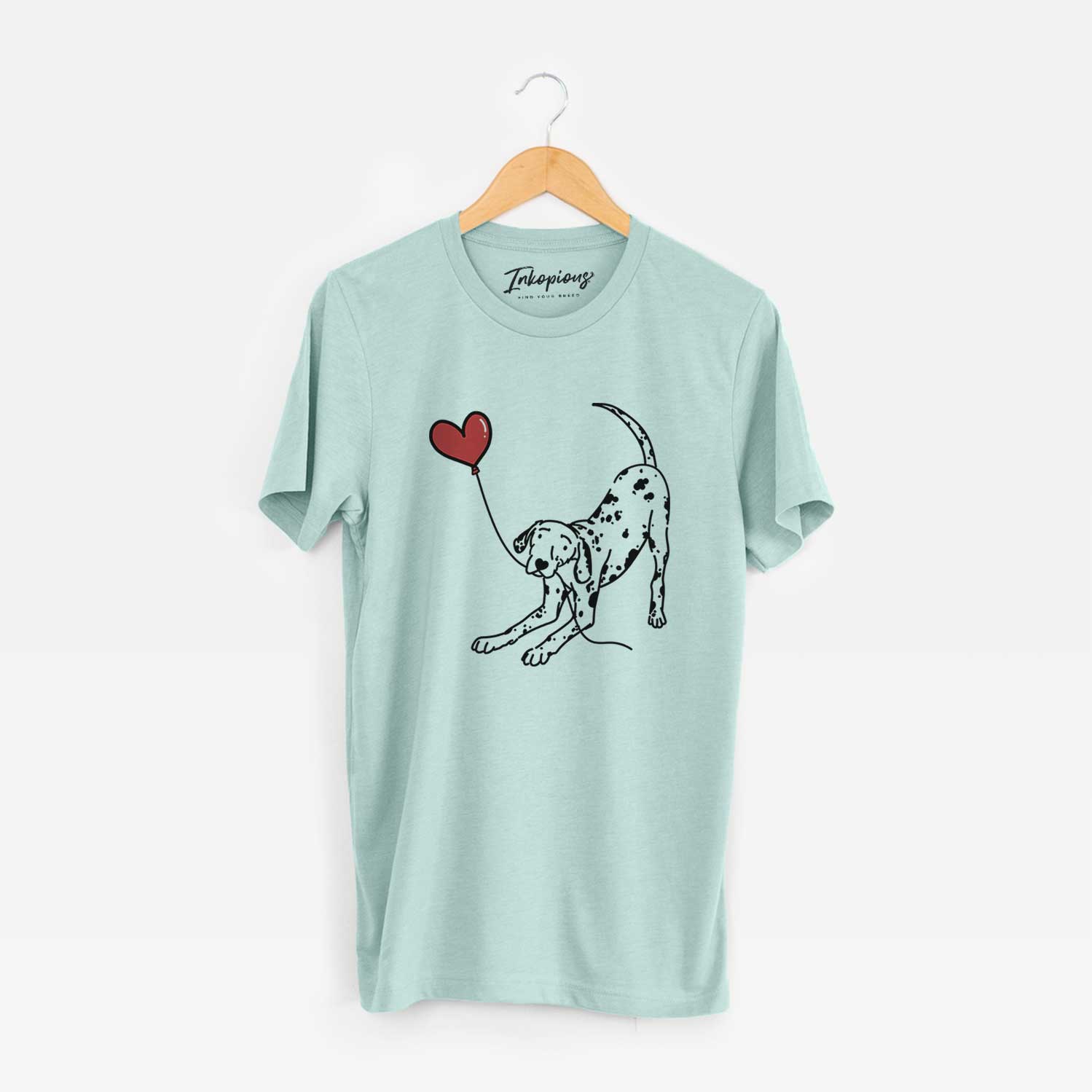 Minimalist line drawing of a Dalmatian Heart String holding a heart balloon on a Heather Sage Unisex crewneck