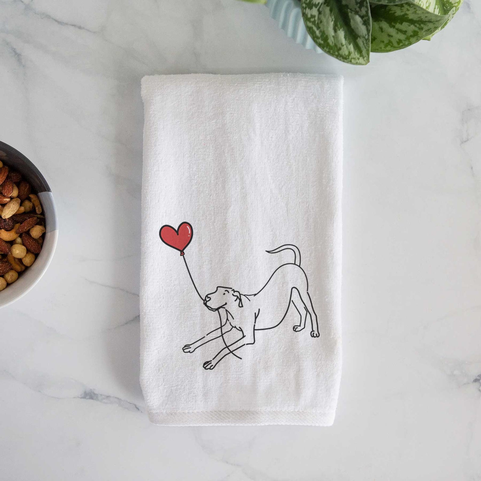 Minimalist line drawing of a Great Dane Heart String holding a heart balloon on a decorative hand towel