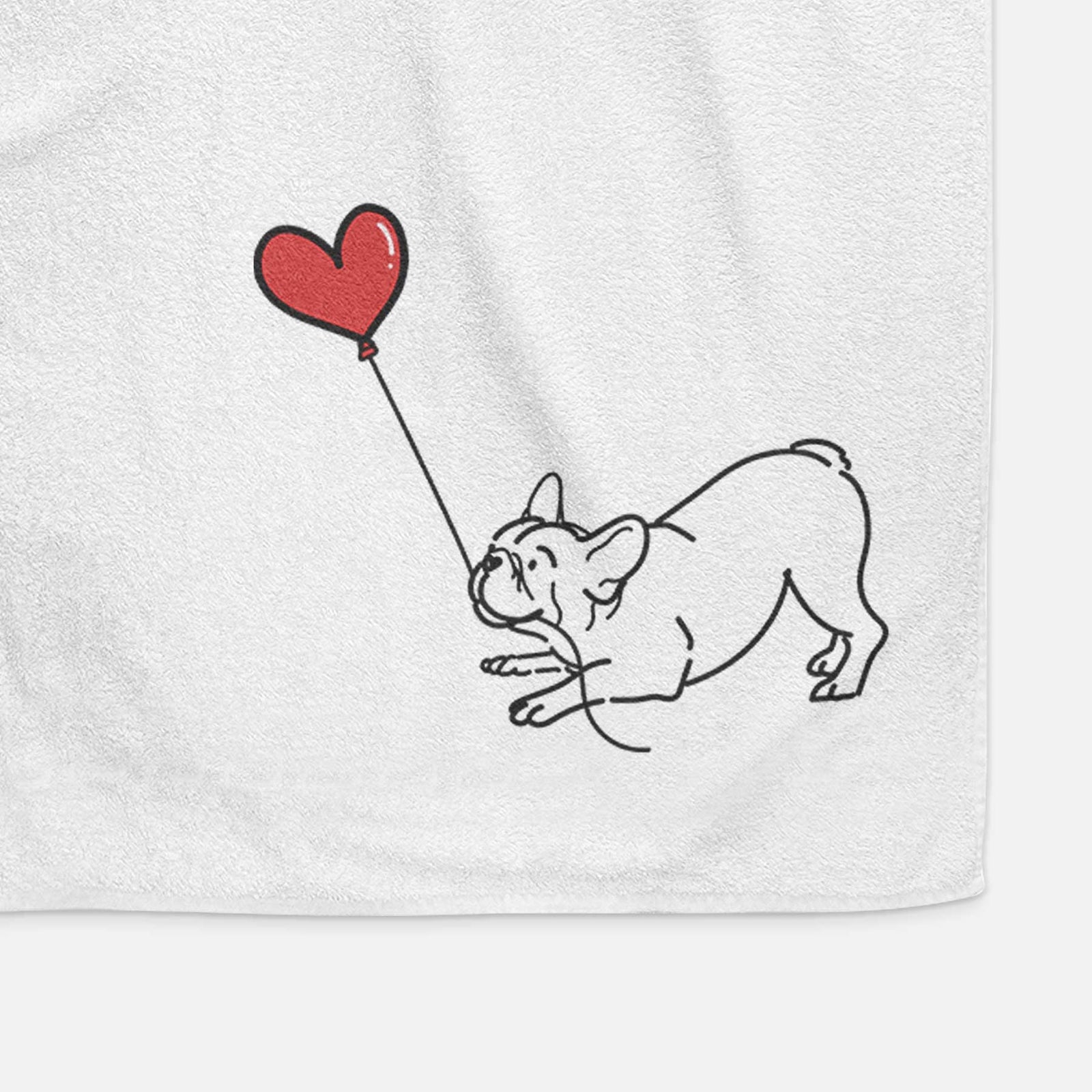 Minimalist line drawing of a Frenchie Heart String holding a heart balloon on a decorative hand towel