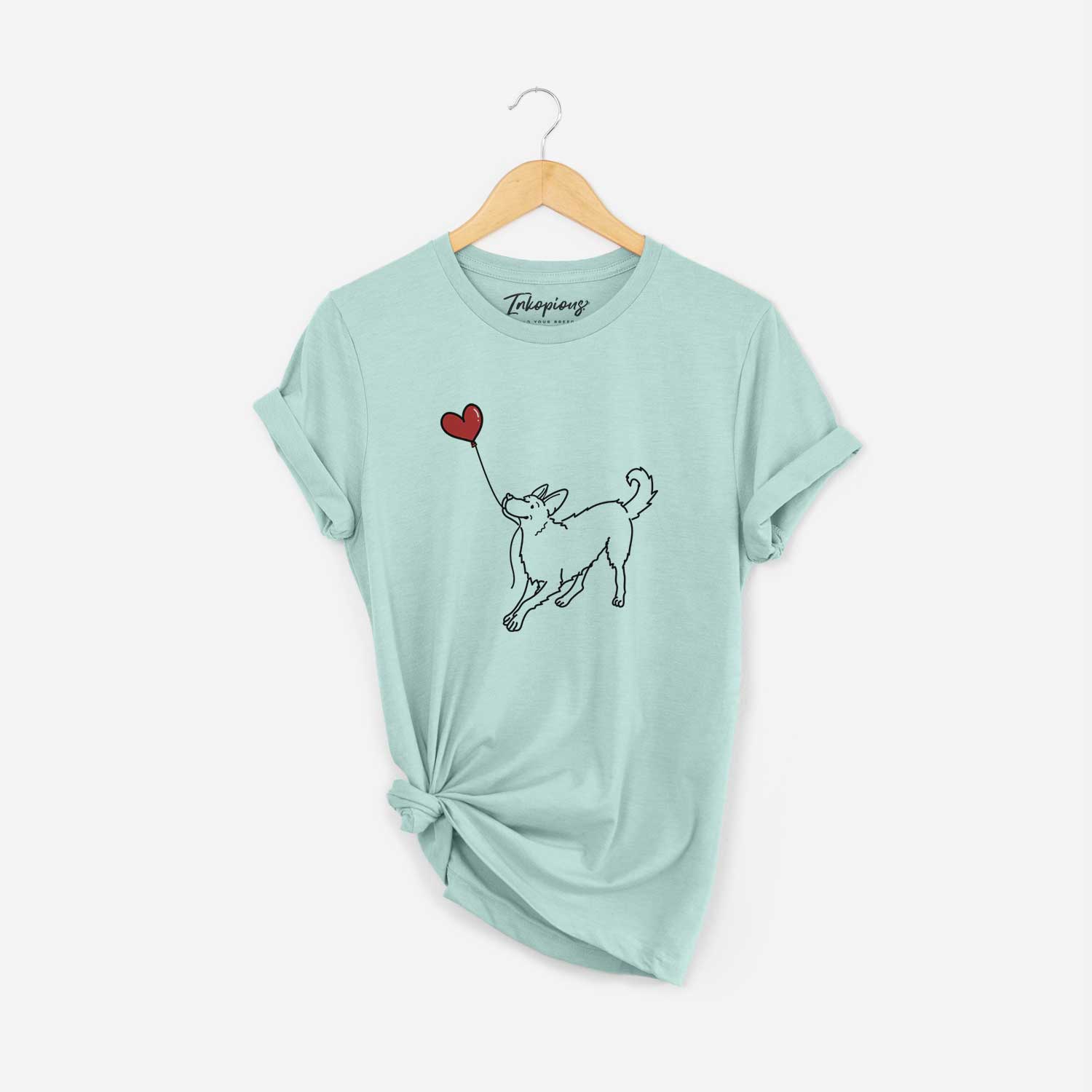 Minimalist line drawing of a German Shepherd Heart String holding a heart balloon on a Heather Sage Unisex crewneck