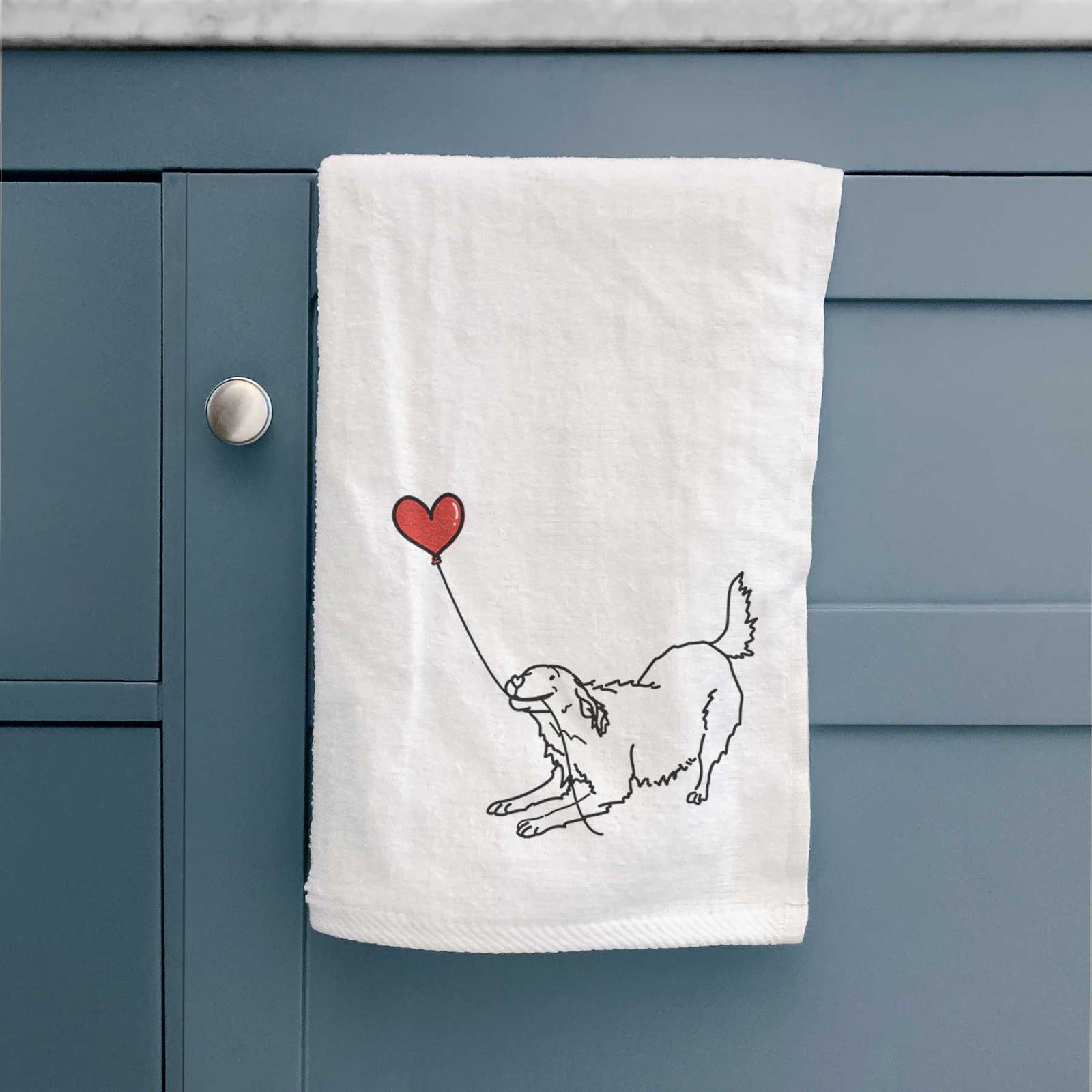 Minimalist line drawing of a Golden Retriever Heart String holding a heart balloon on a decorative hand towel