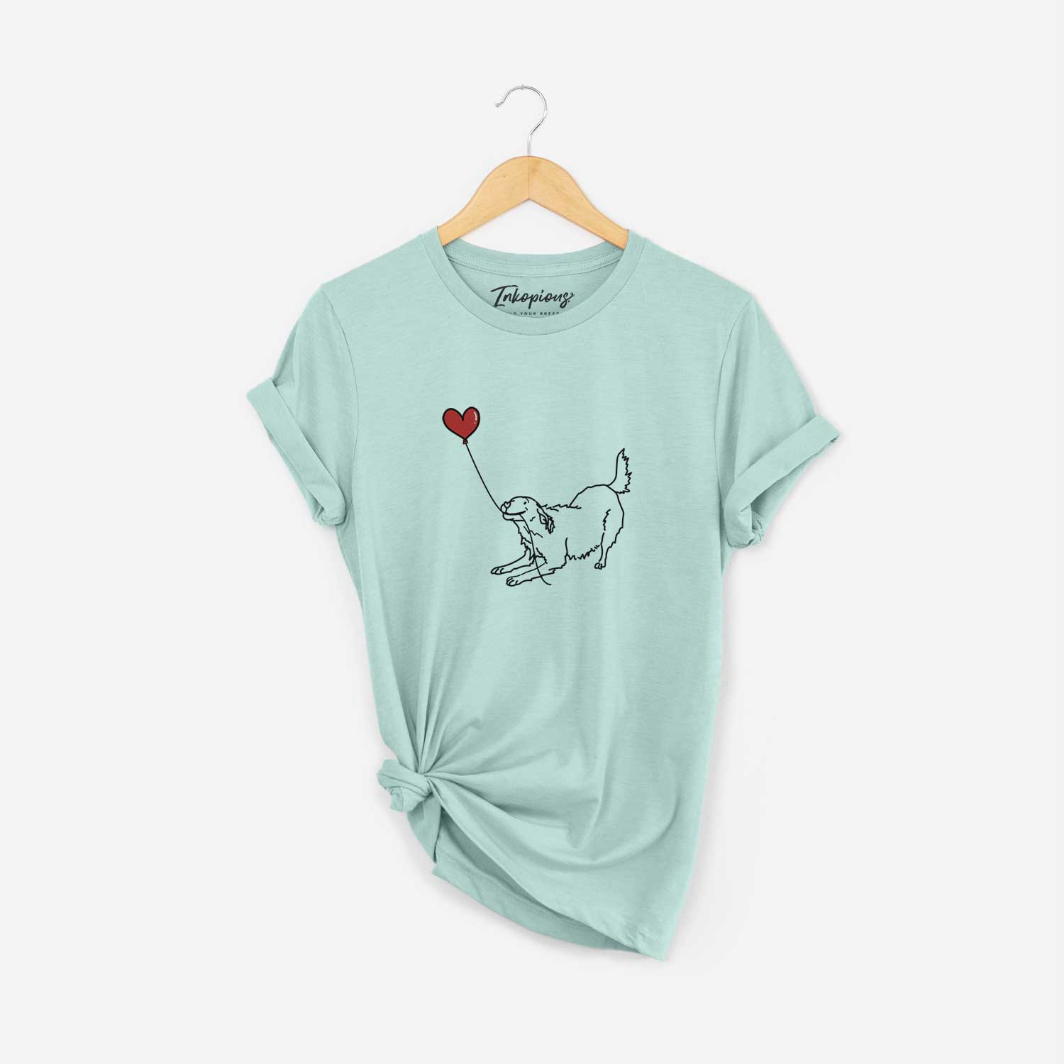 Minimalist line drawing of a Golden Retriever Heart String holding a heart balloon on a Heather Sage Unisex crewneck