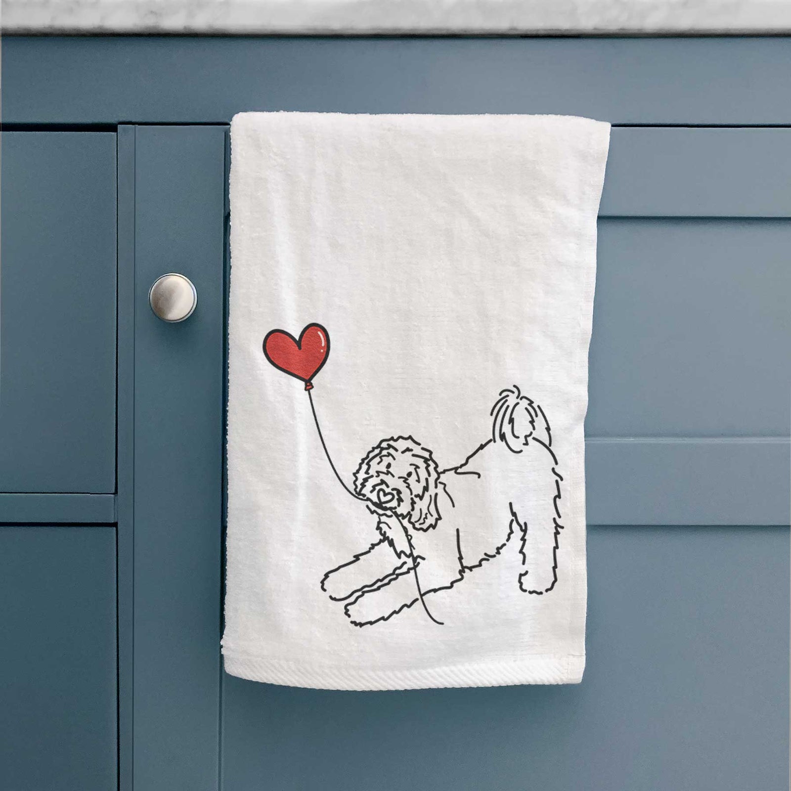 Minimalist line drawing of a Goldendoodle Heart String holding a heart balloon on a decorative hand towel