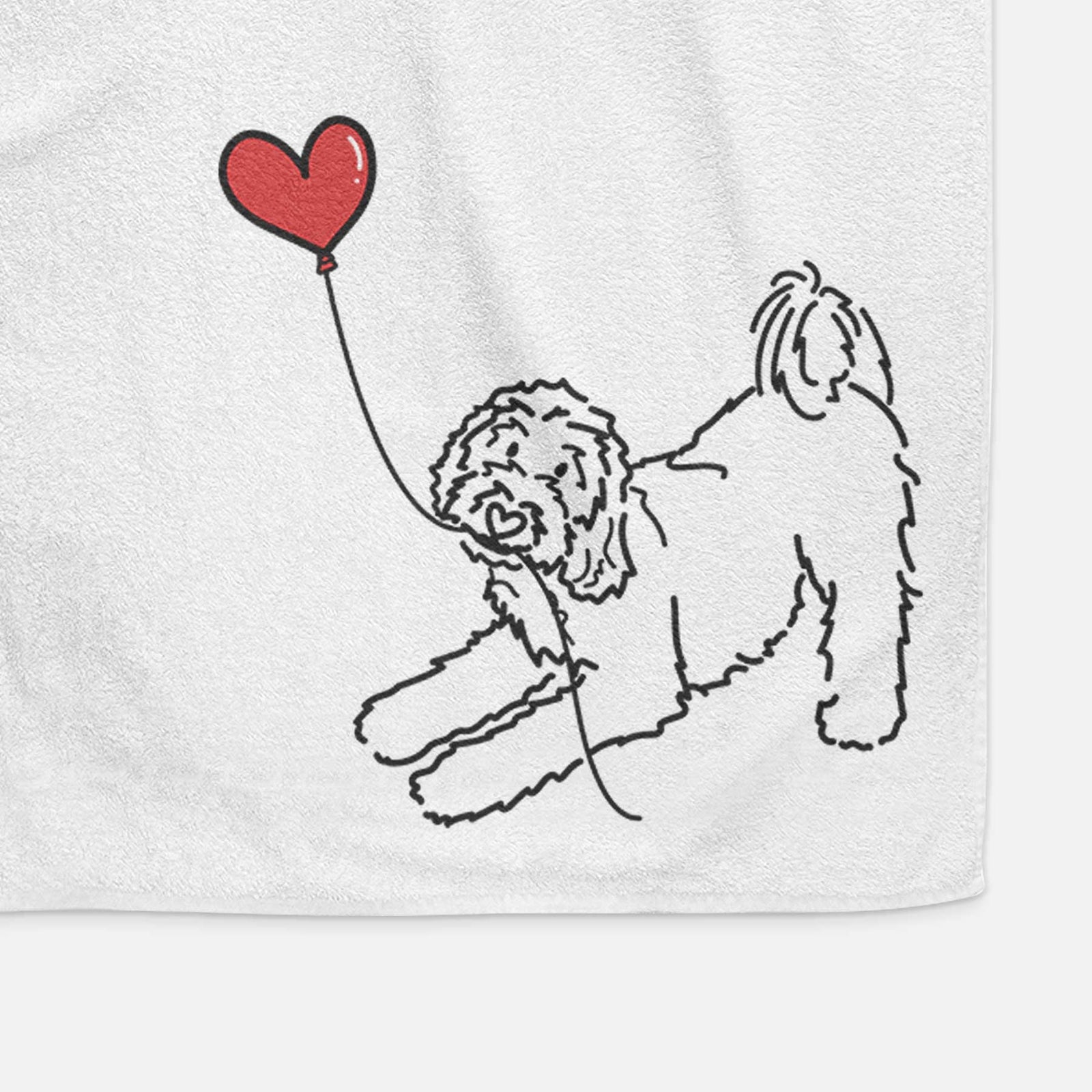 Minimalist line drawing of a Goldendoodle Heart String holding a heart balloon on a decorative hand towel