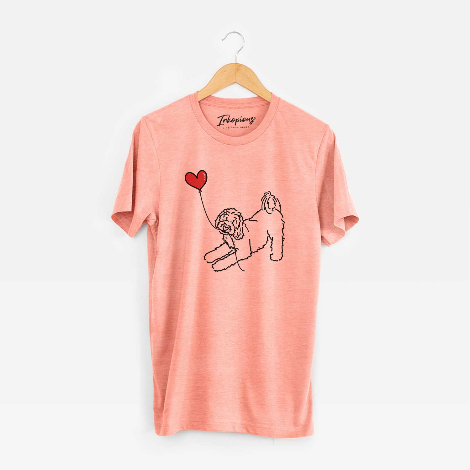 Minimalist line drawing of a Goldendoodle Heart String holding a heart balloon on a Sunset Unisex crewneck
