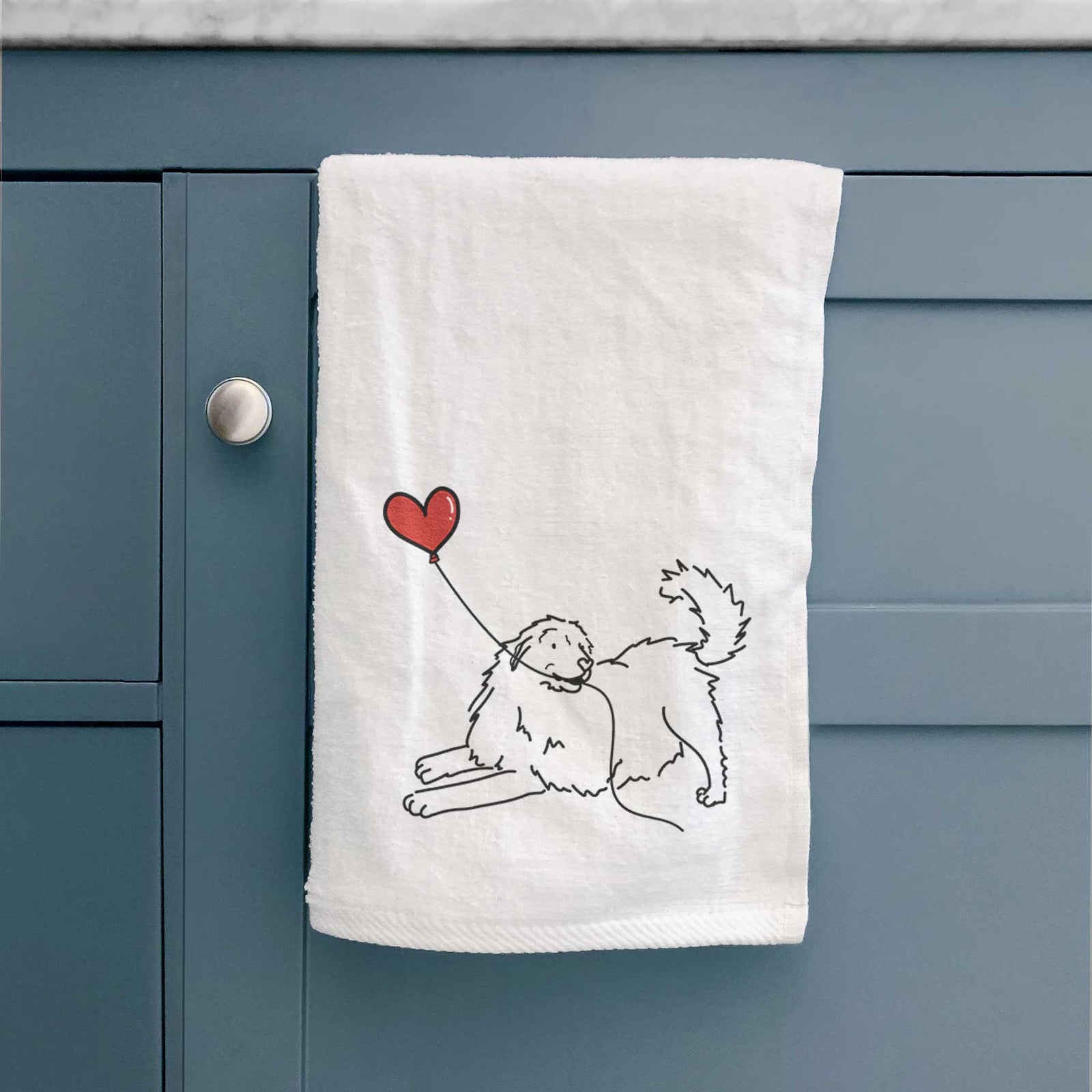 Minimalist line drawing of a Great Pyrenees Heart String holding a heart balloon on a decorative hand towel