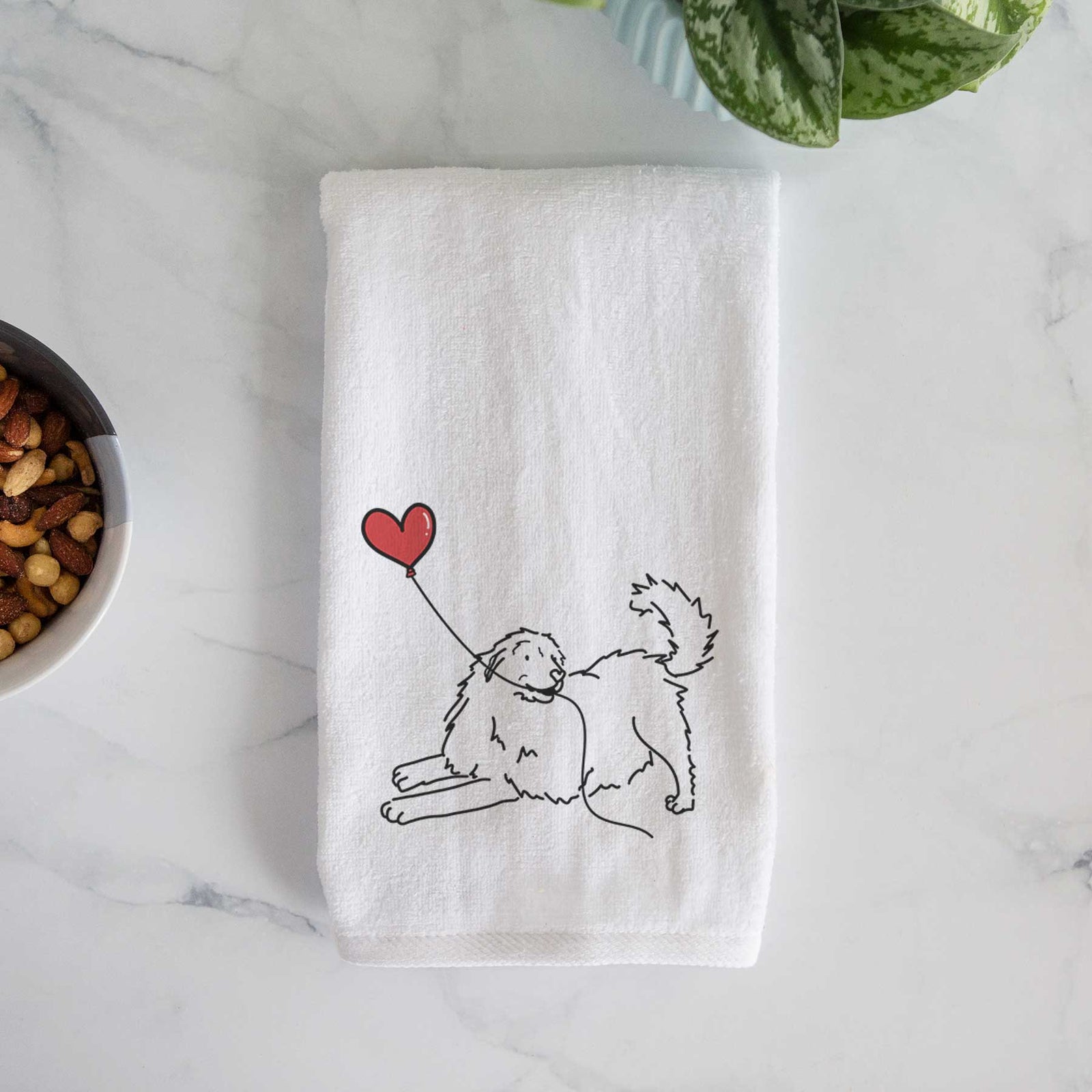 Minimalist line drawing of a Great Pyrenees Heart String holding a heart balloon on a decorative hand towel