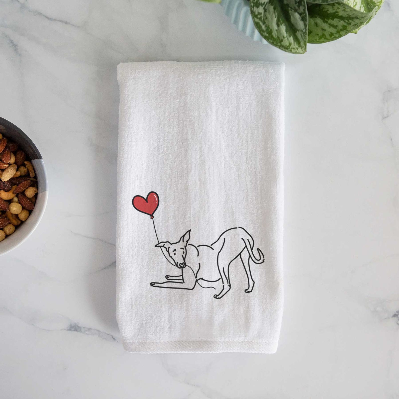 Minimalist line drawing of a Greyhound Heart String holding a heart balloon on a decorative hand towel