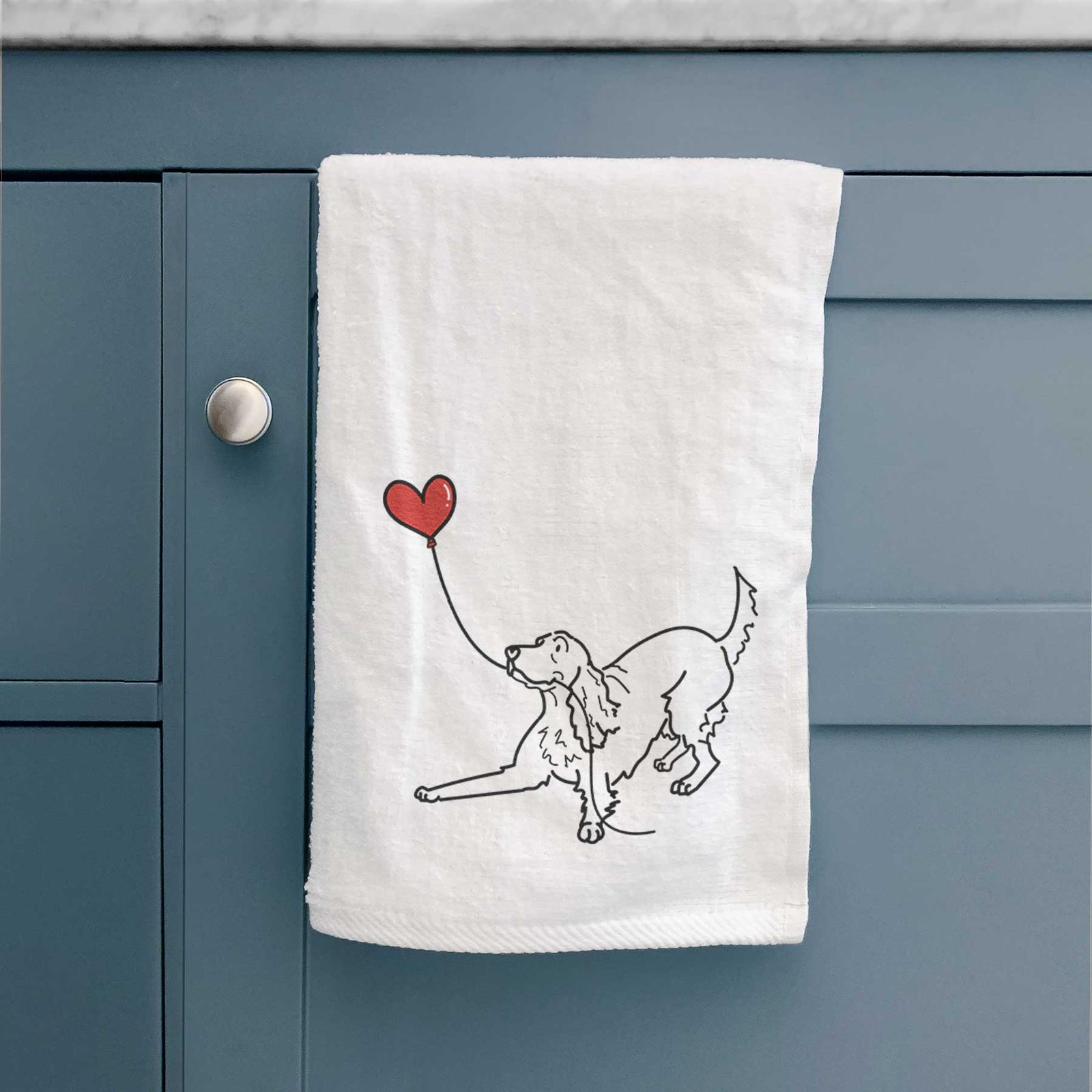 Minimalist line drawing of an Irish Setter Heart String holding a heart balloon on a decorative hand towel