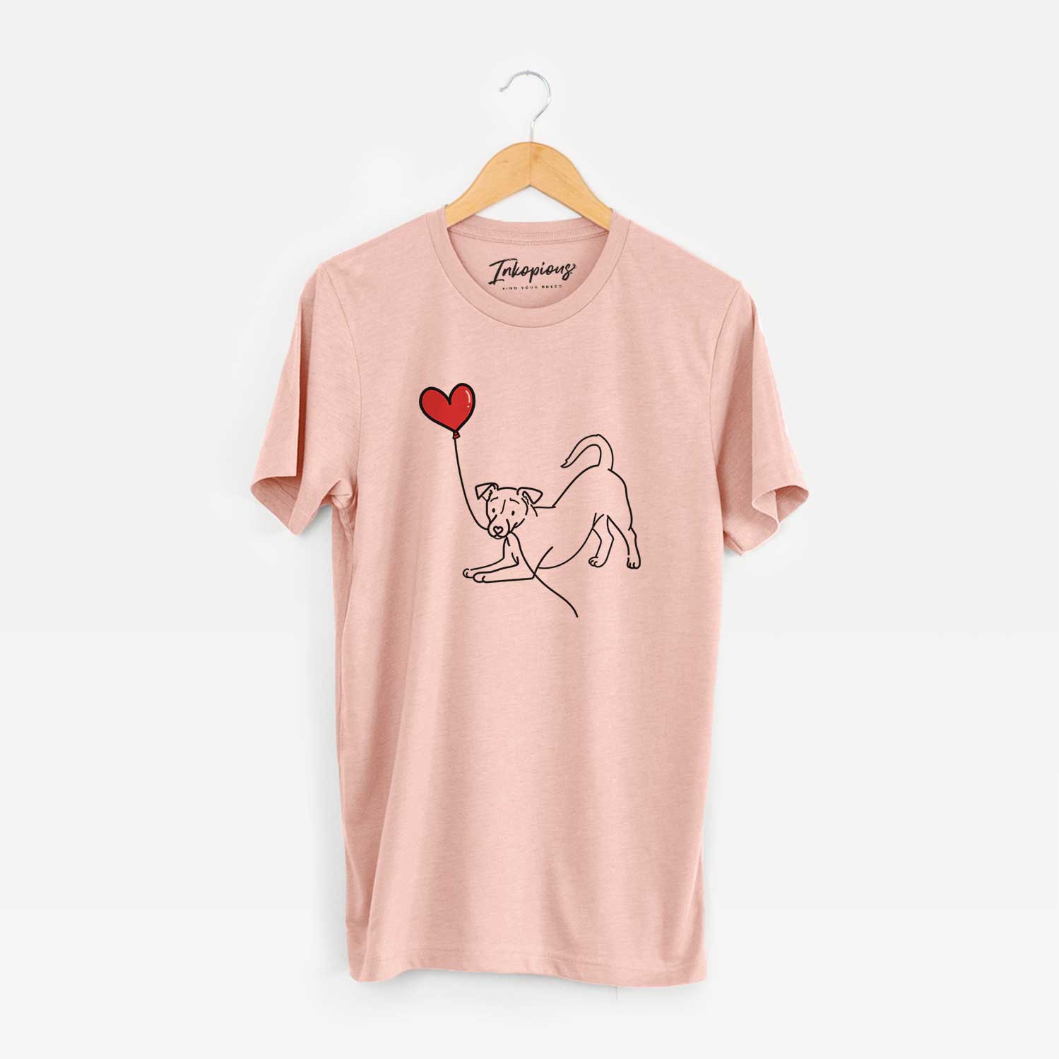 Minimalist line drawing of a Jack Russell Terrier Heart String holding a heart balloon on a Peach Unisex crewneck