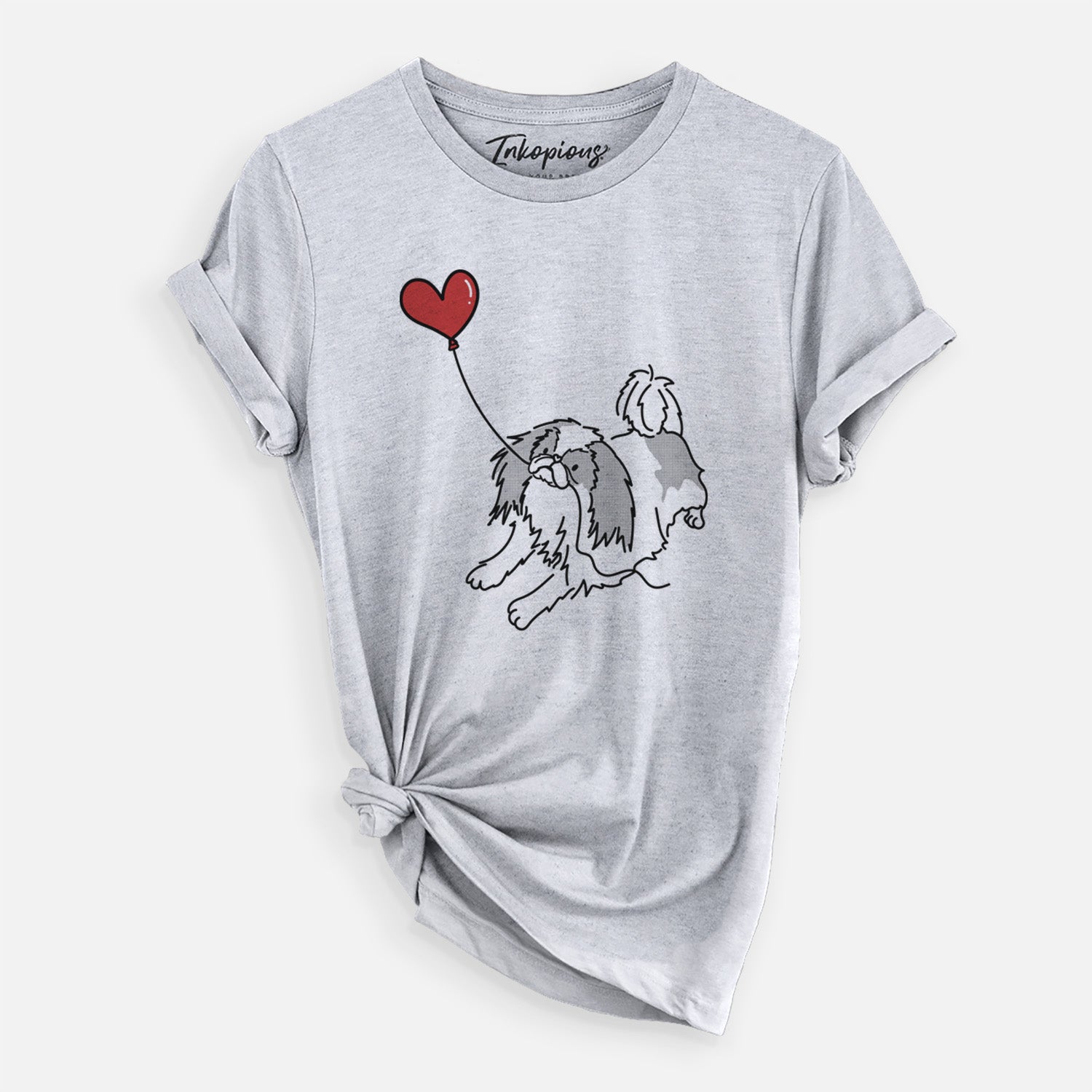 Minimalist line drawing of a Japanese Chin Heart String holding a heart balloon on a Grey Unisex crewneck