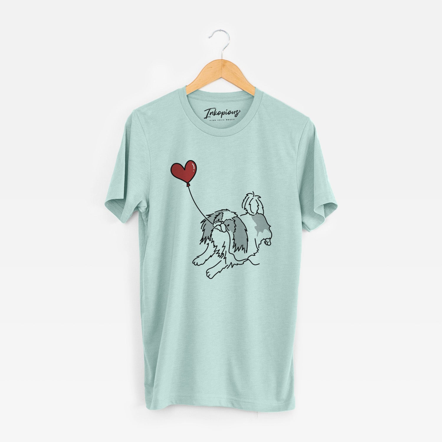 Minimalist line drawing of a Japanese Chin Heart String holding a heart balloon on a Heather Sage Unisex crewneck