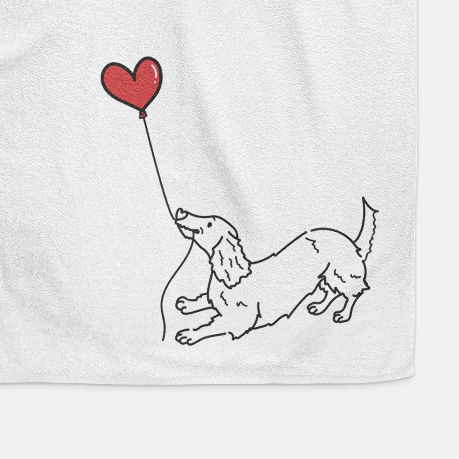Minimalist line drawing of a Long Haired Dachshund Heart String holding a heart balloon on a decorative hand towel