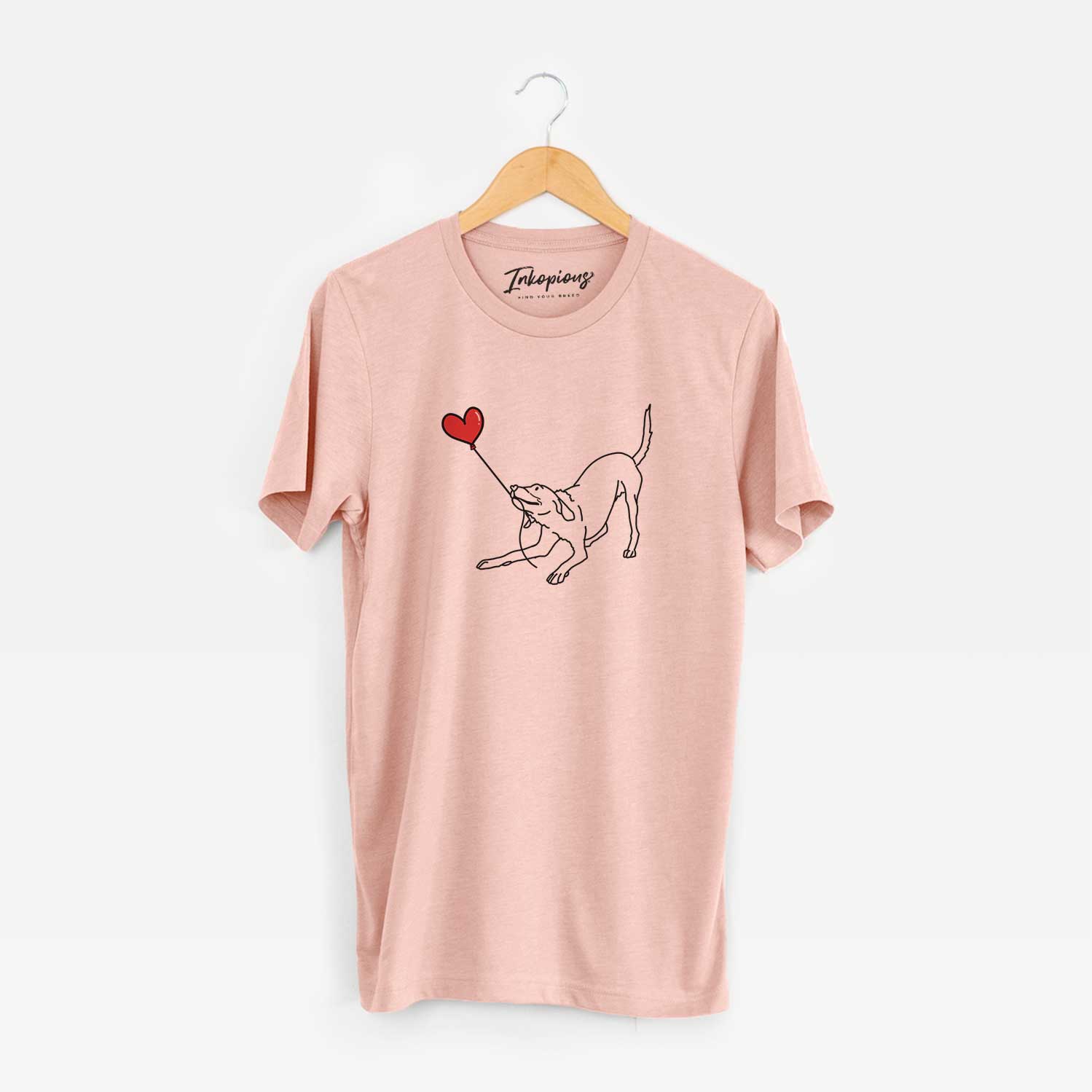 Minimalist line drawing of a Labrador Retriever Heart String holding a heart balloon on a Peach Unisex crewneck