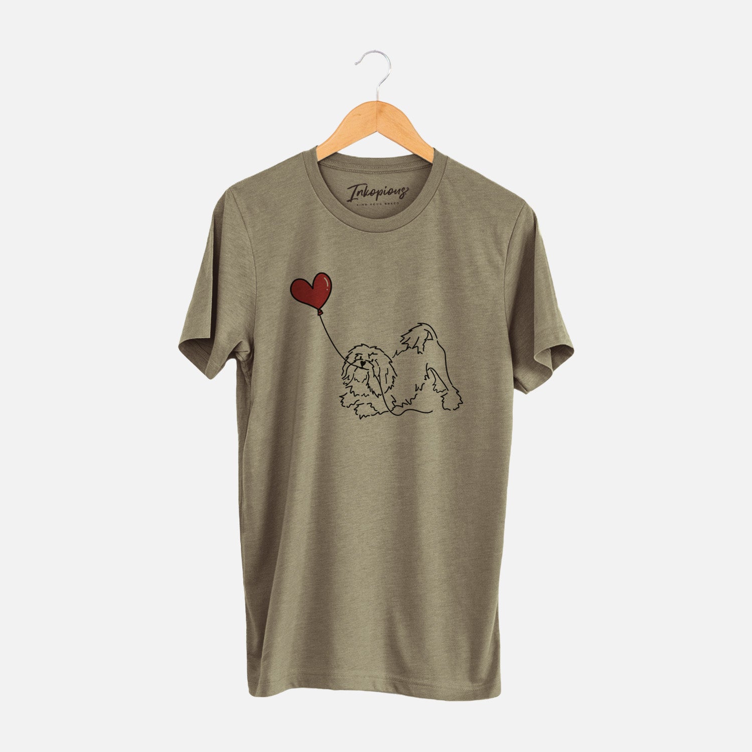 Minimalist line drawing of a Lowchen Heart String holding a heart balloon on an Olive Unisex crewneck