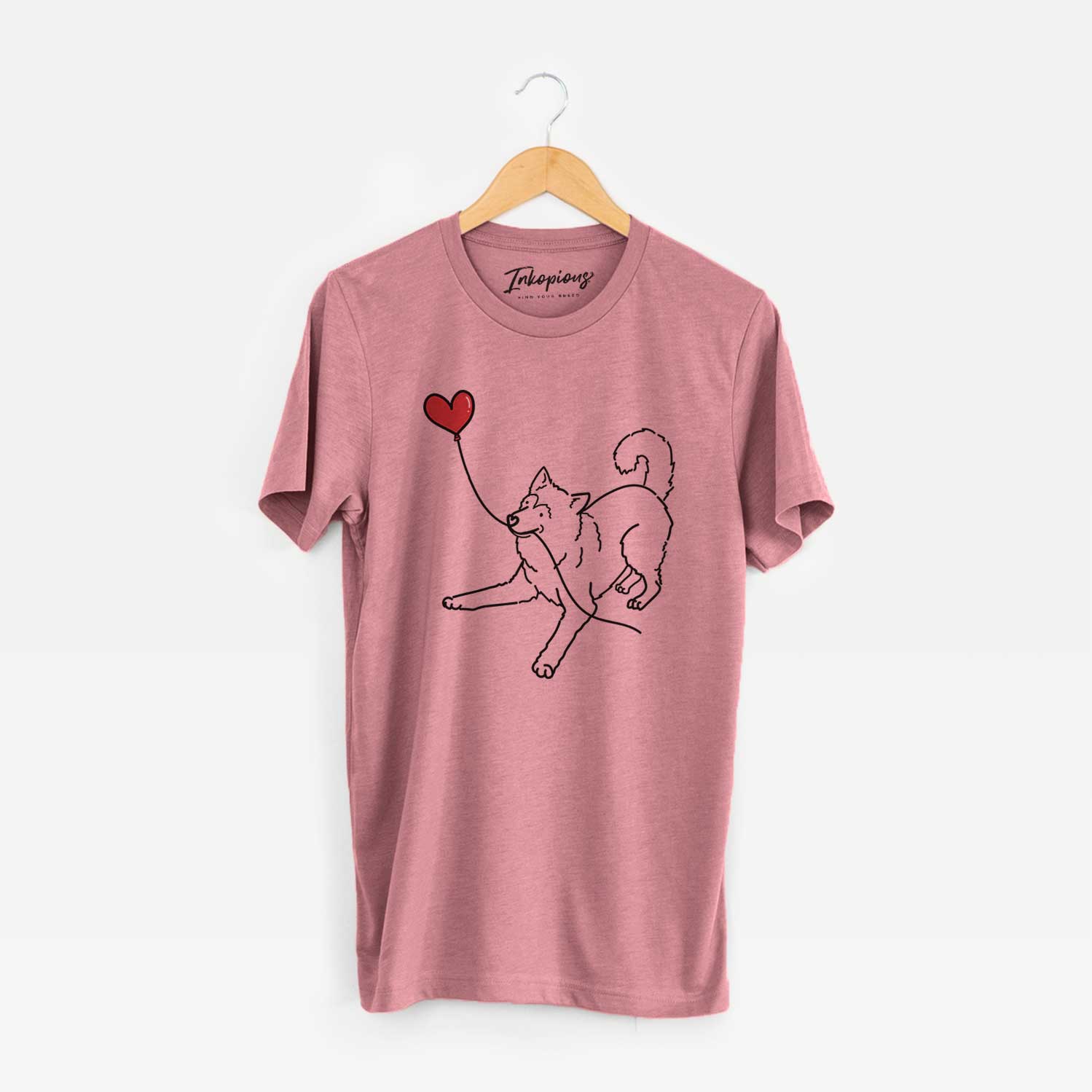 Minimalist line drawing of an Alaskan Malamute Heart String holding a heart balloon on a Mauve Unisex crewneck