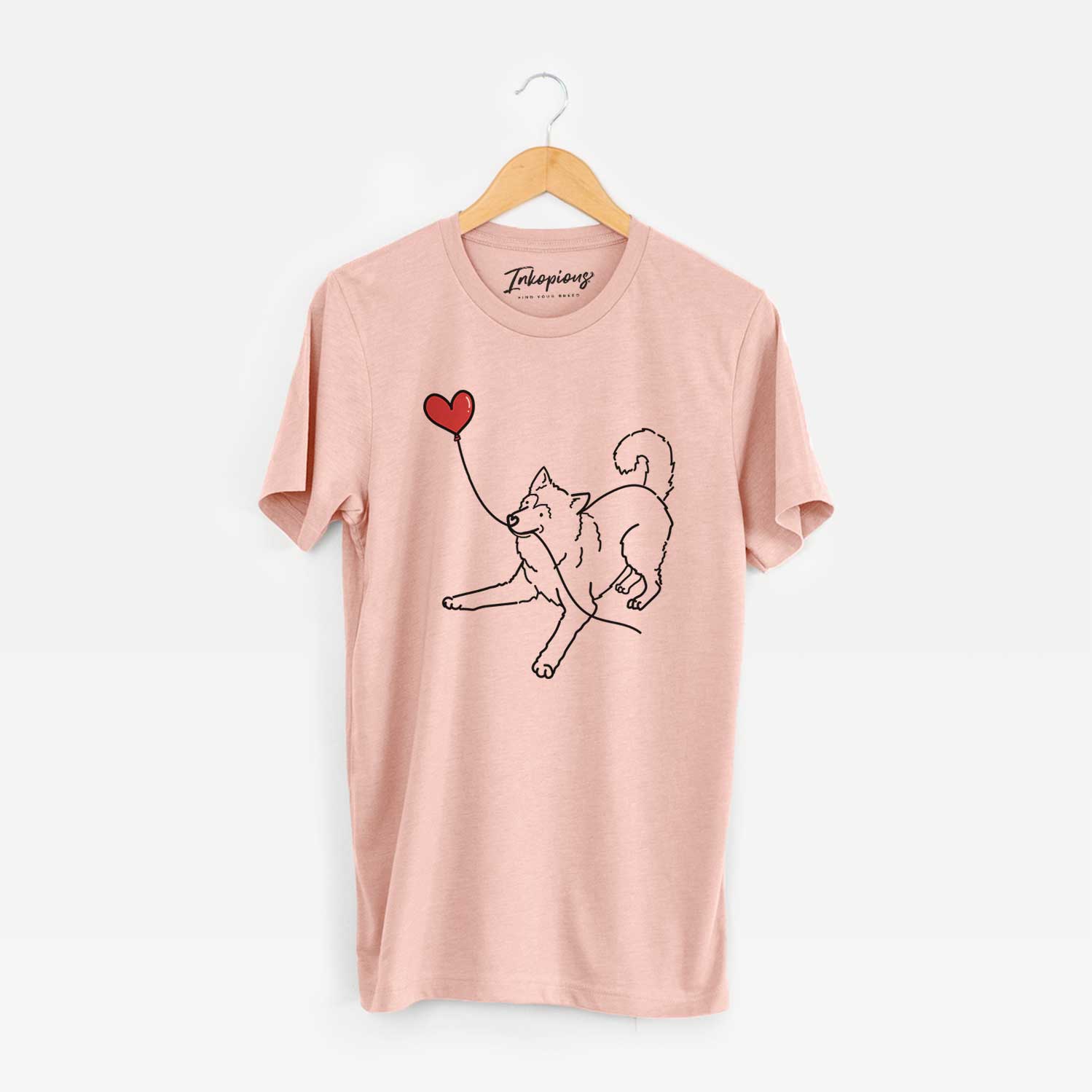 Minimalist line drawing of an Alaskan Malamute Heart String holding a heart balloon on a Peach Unisex crewneck