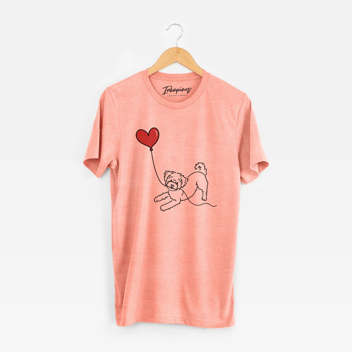 Minimalist line drawing of a Morkie Heart String holding a heart balloon on a Sunset Unisex crewneck