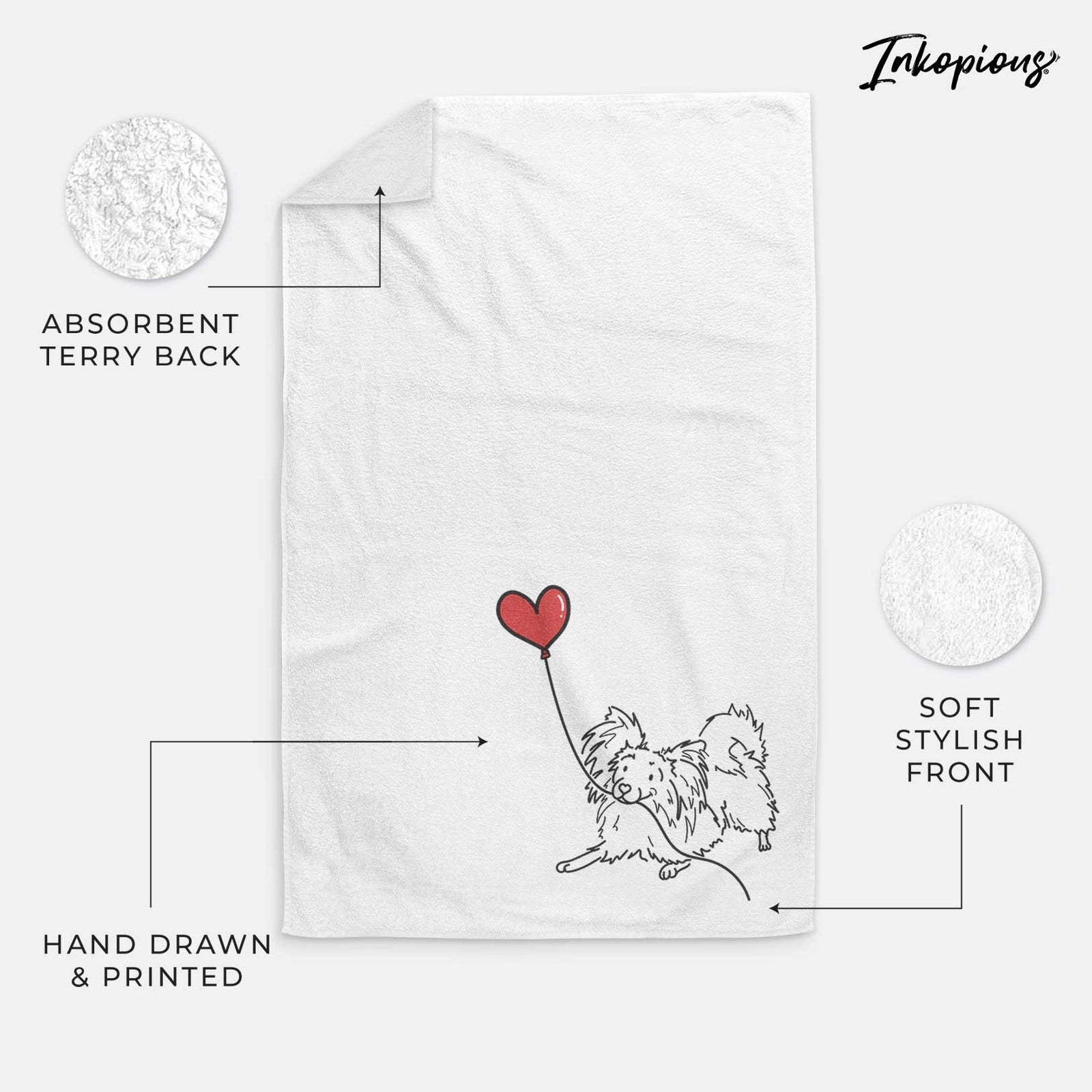 Minimalist line drawing of a Papillon Heart String holding a heart balloon on a decorative hand towel