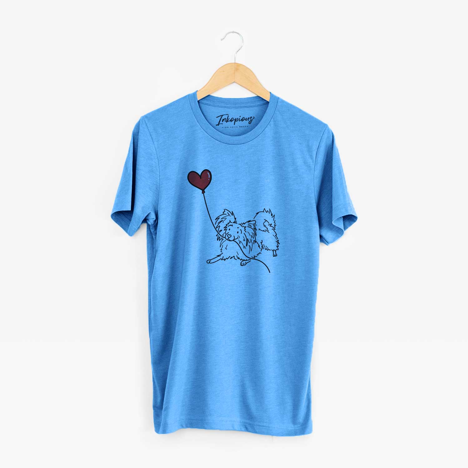 Minimalist line drawing of a Papillon Heart String holding a heart balloon on a Blue Unisex crewneck