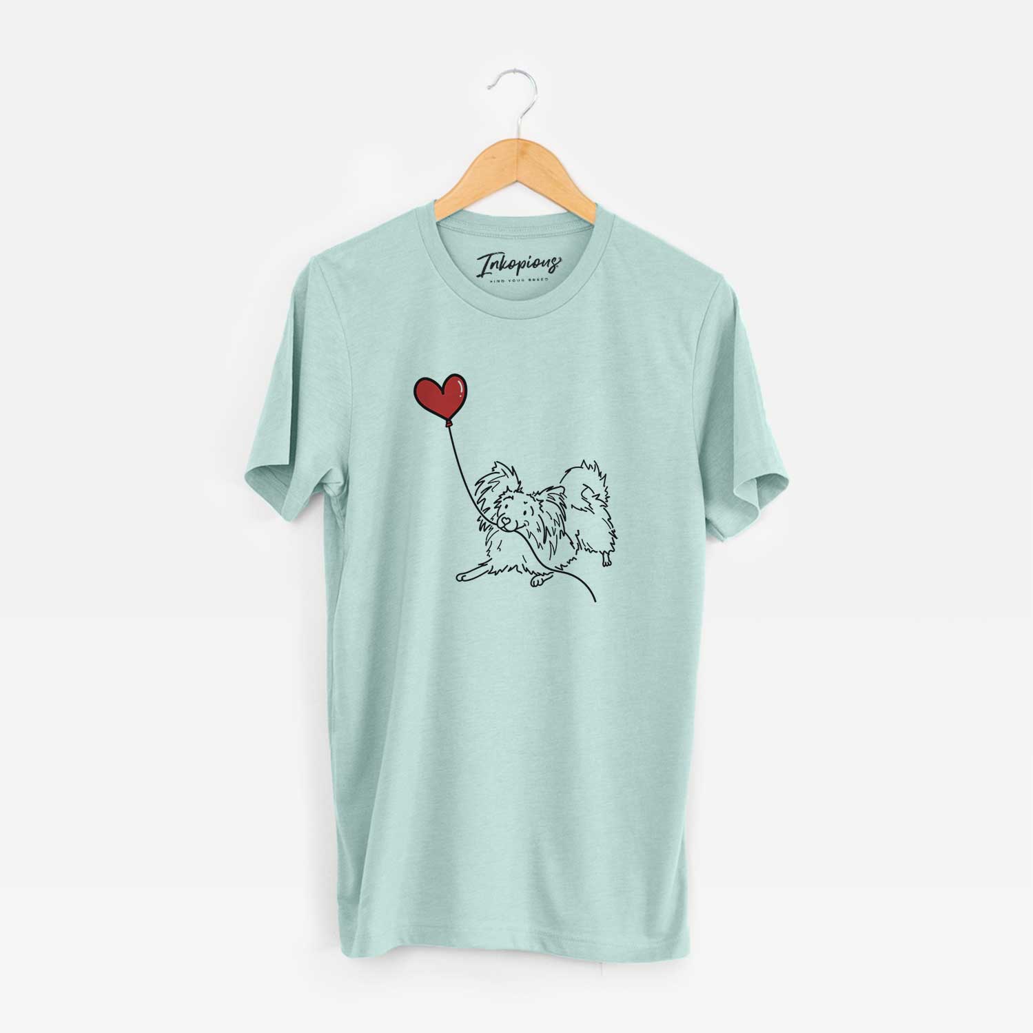 Minimalist line drawing of a Papillon Heart String holding a heart balloon on a Heather Sage Unisex crewneck