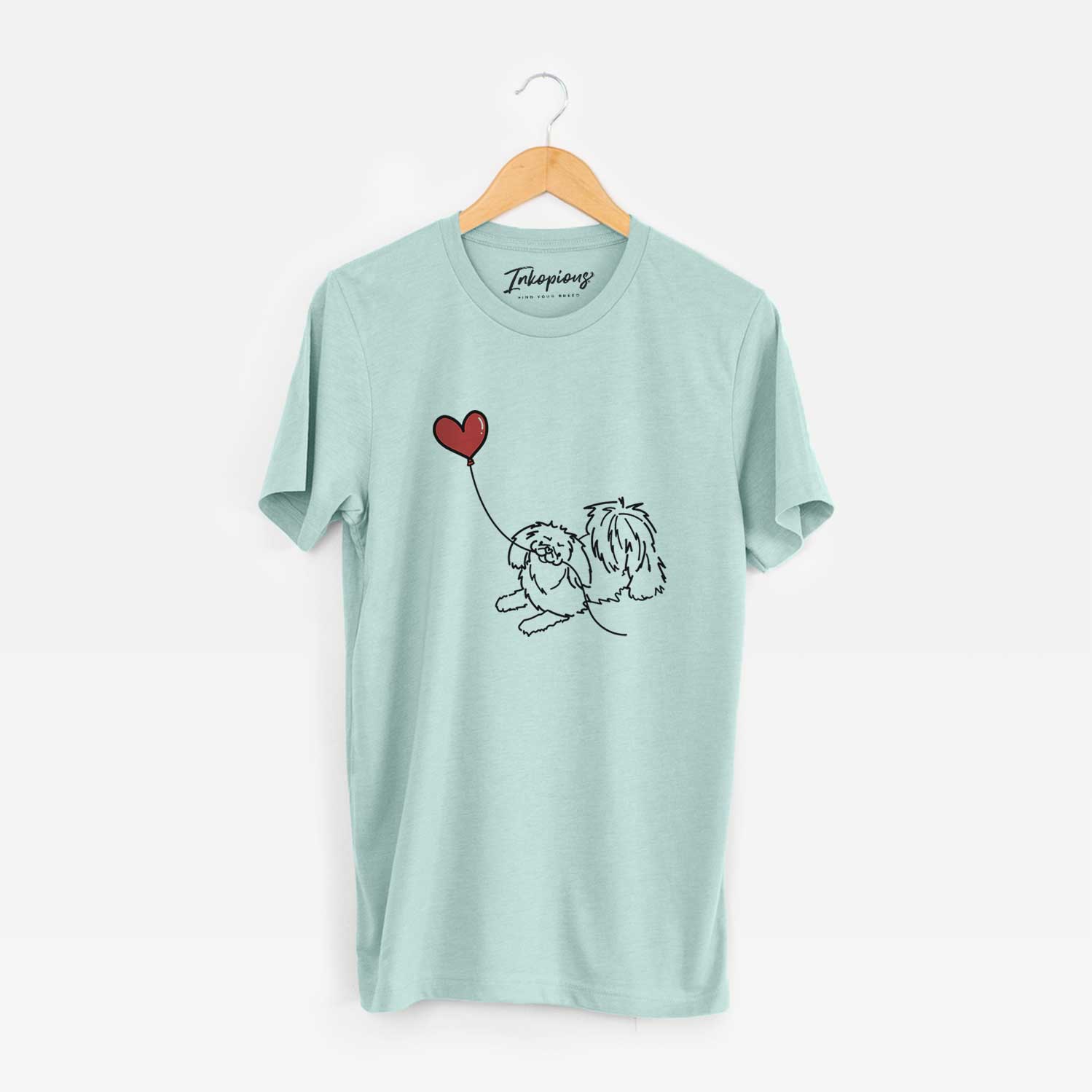 Minimalist line drawing of a Pekingese Heart String holding a heart balloon on a Heather Sage Unisex crewneck