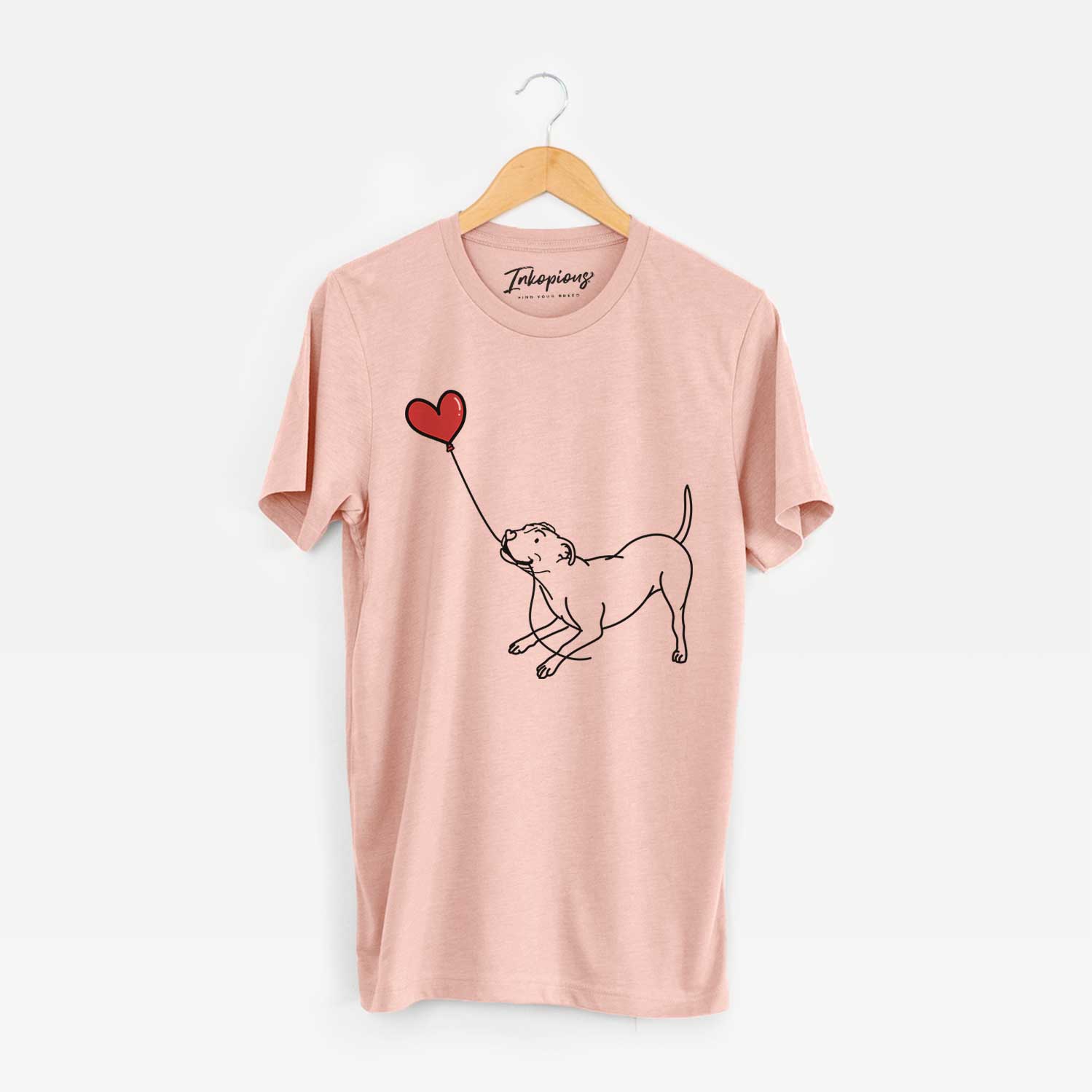 Minimalist line drawing of a Pitbull Terrier Heart String holding a heart balloon on a Peach Unisex crewneck