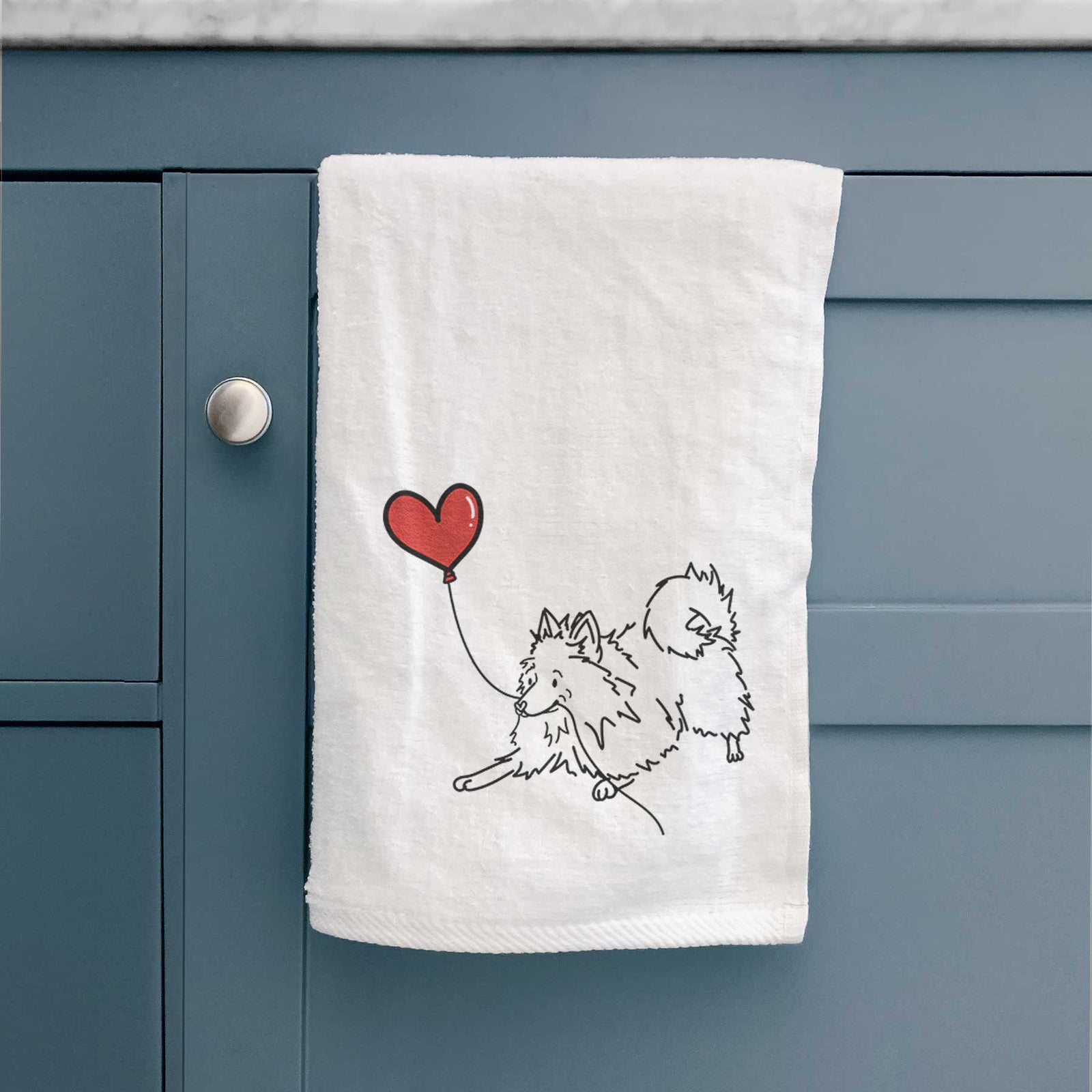 Minimalist line drawing of a Pomeranian Heart String holding a heart balloon on a decorative hand towel