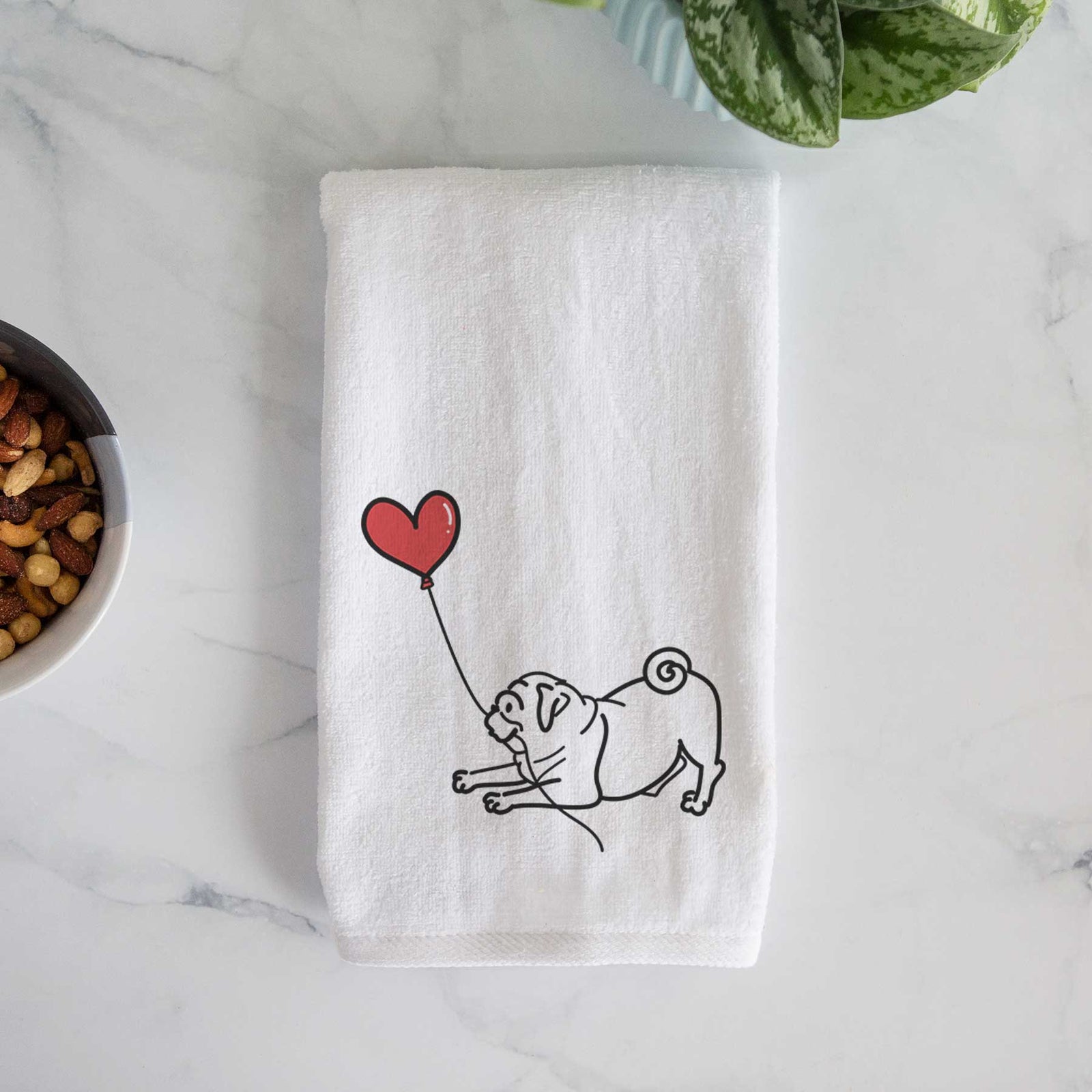 Minimalist line drawing of a Pug Heart String holding a heart balloon on a decorative hand towel
