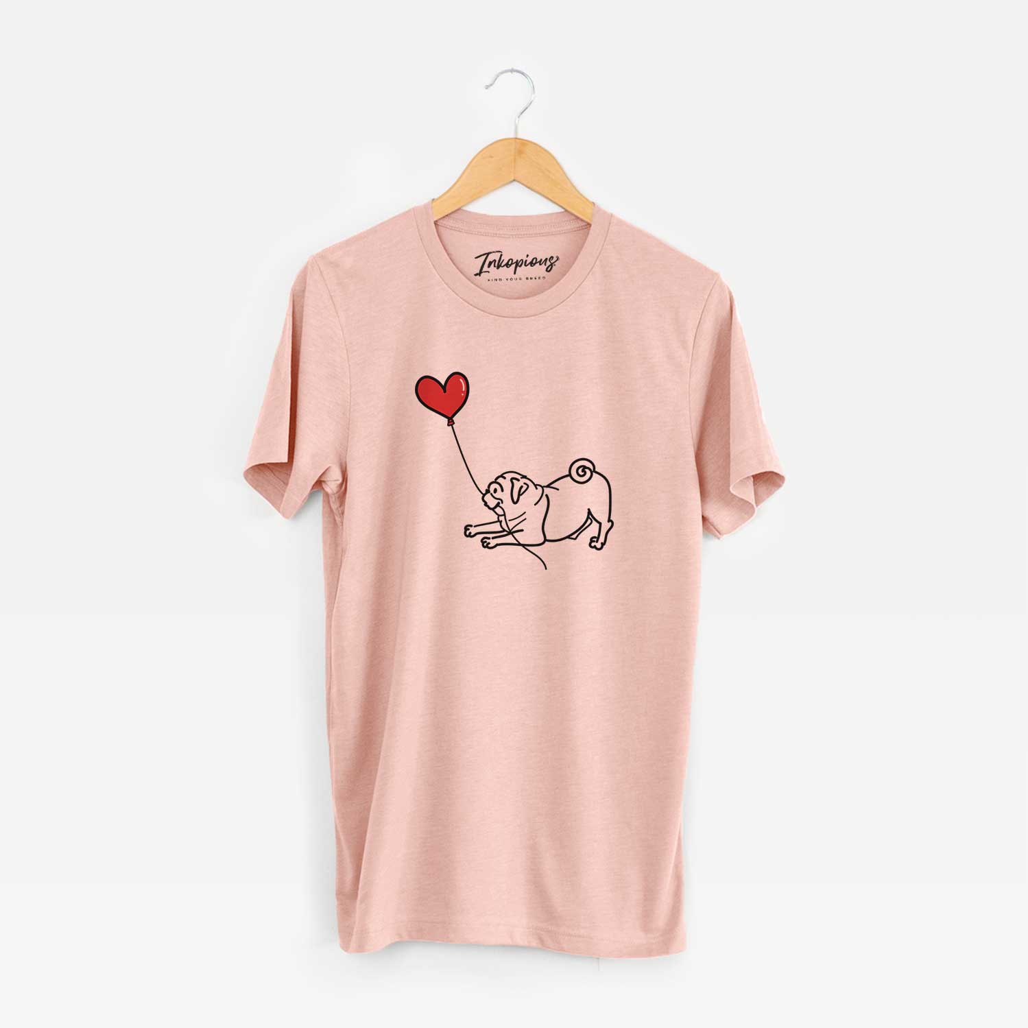 Minimalist line drawing of a Pug Heart String holding a heart balloon on a Peach Unisex crewneck