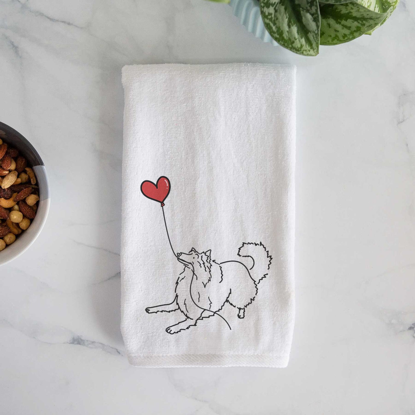 Minimalist line drawing of a Rough Collie Heart String holding a heart balloon on a decorative hand towel
