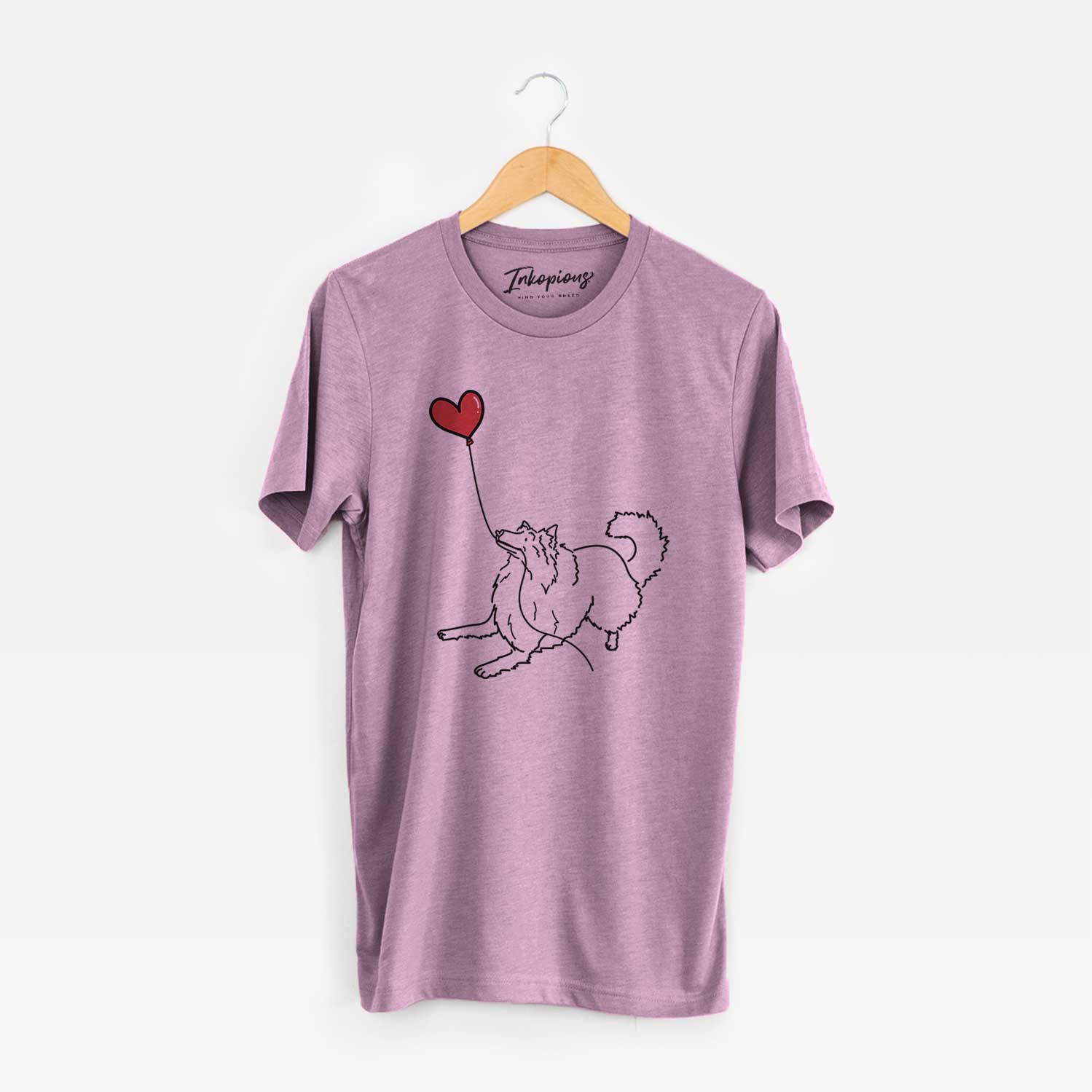 Minimalist line drawing of a Rough Collie Heart String holding a heart balloon on an Orchid Unisex crewneck