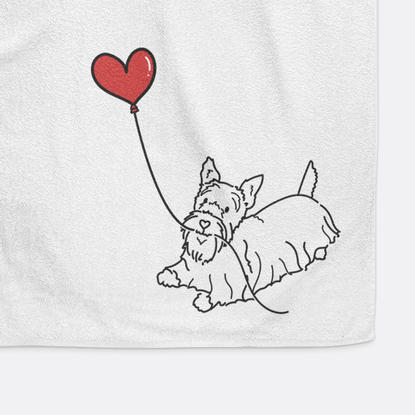 Minimalist line drawing of a Scottish Terrier Heart String holding a heart balloon on a decorative hand towel