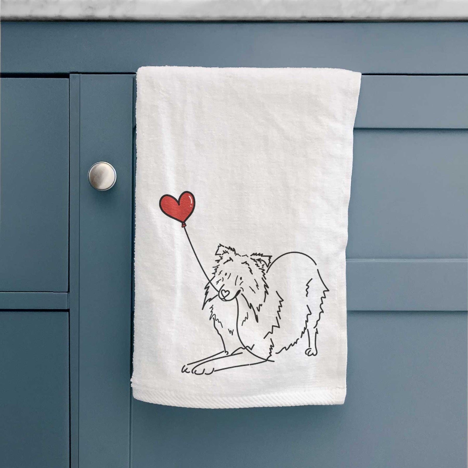 Minimalist line drawing of a Shetland Sheepdog Heart String holding a heart balloon on a decorative hand towel